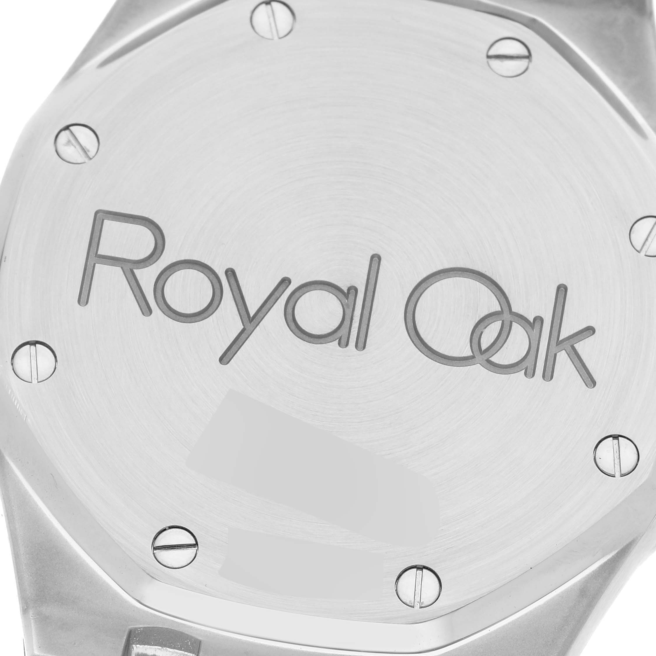 This image shows the case back of the Audemars Piguet Royal Oak 25730SA.01.078 Men's Steel and Gold (two tone) Grey Dial 25730SA.01.078 Men's Steel and Gold (two tone) Grey Dial watch, featuring a brushed finish and visible screws.