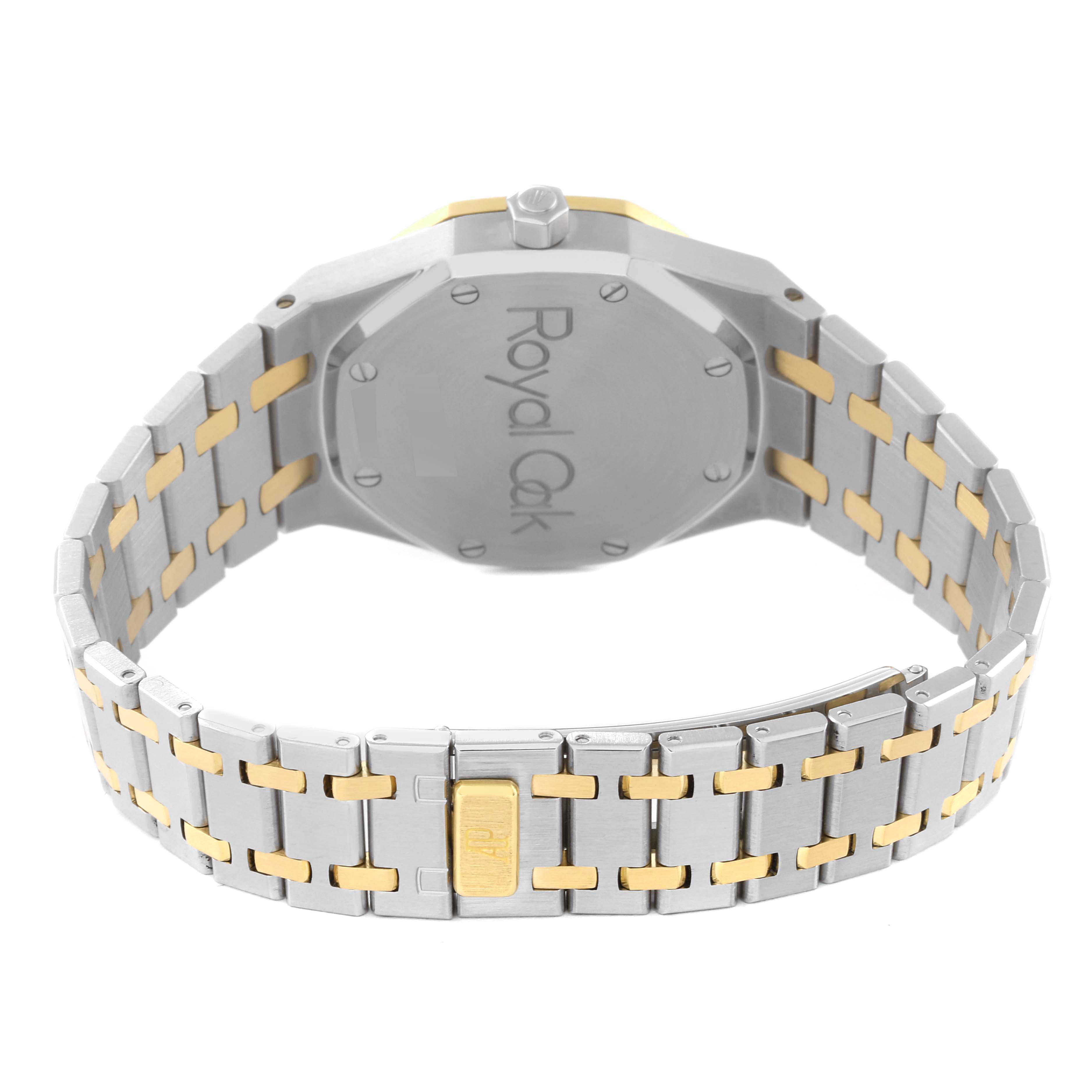 The image shows the back and bracelet of an Audemars Piguet Royal Oak 25730SA.01.078 Men's Steel and Gold (two tone) Grey Dial 25730SA.01.078 Men's Steel and Gold (two tone) Grey Dial watch, highlighting its two-tone metal design.