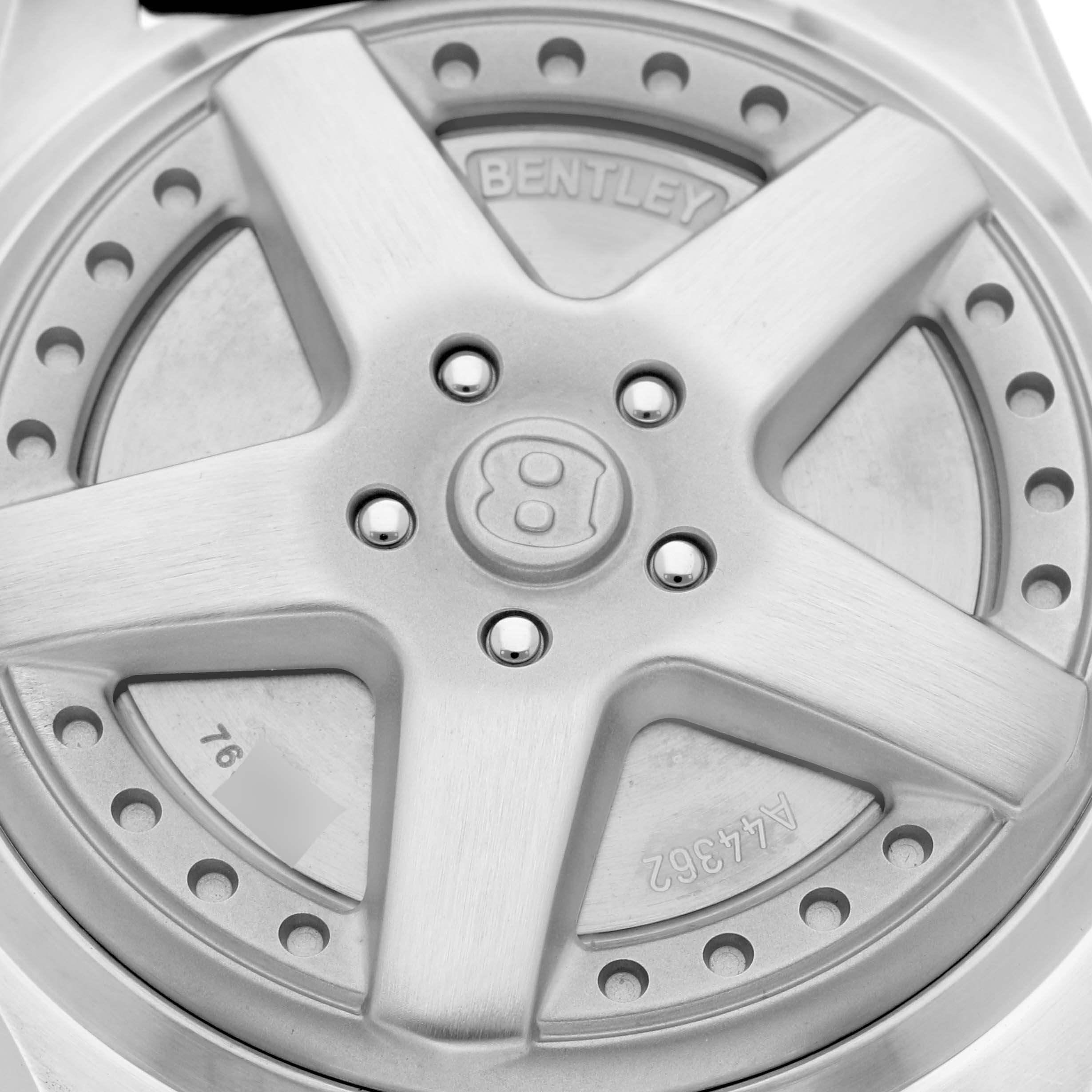 The image shows a top-down view of the back case design of a Bentley model by Breitling, featuring a wheel-like pattern.