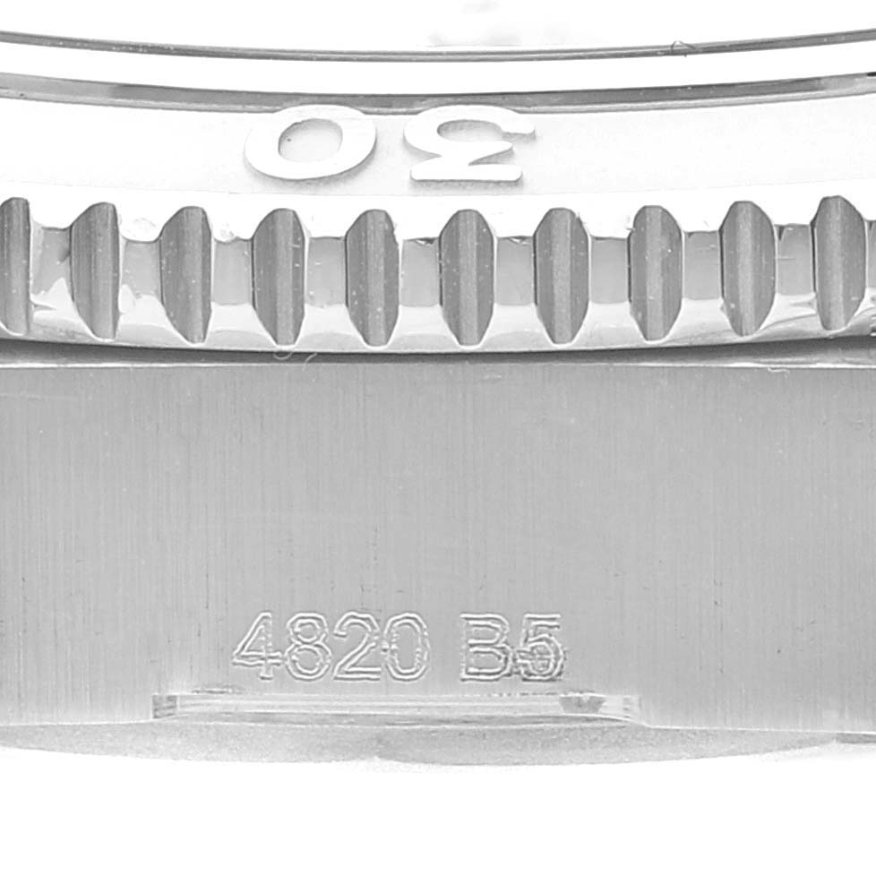 The image shows a close-up of the bezel teeth and part of the case of the Breitling A17316 Women's Stainless Steel White Dial A17316 Women's Stainless Steel White Dial Superocean 36mm White Dial Ladies Watch A17316.