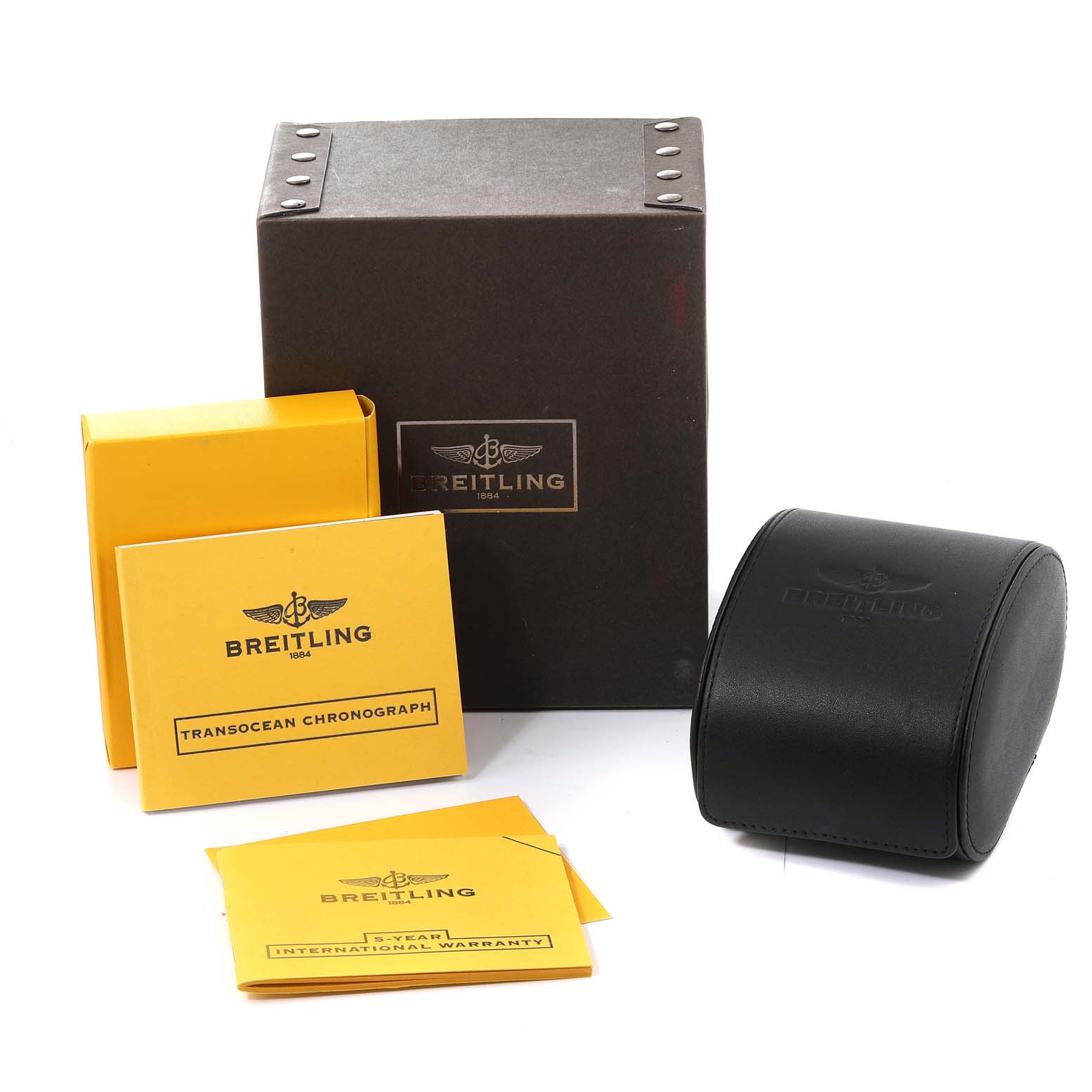 The image shows the Breitling Transocean AB015212/G724 Men's Stainless Steel Silver Dial AB015212/G724 Men's Stainless Steel Silver Dial watch packaging, including the box, manuals, and watch case.