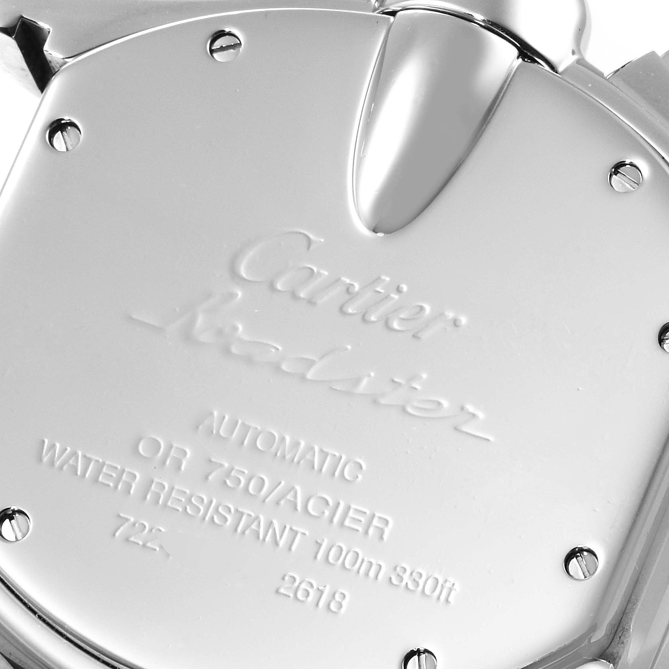 The image shows the back case of a Cartier Roadster W62027Z1 Men's Steel and Gold (two tone) Silver Dial W62027Z1 Men's Steel and Gold (two tone) Silver Dial watch, highlighting its engravings and screws.