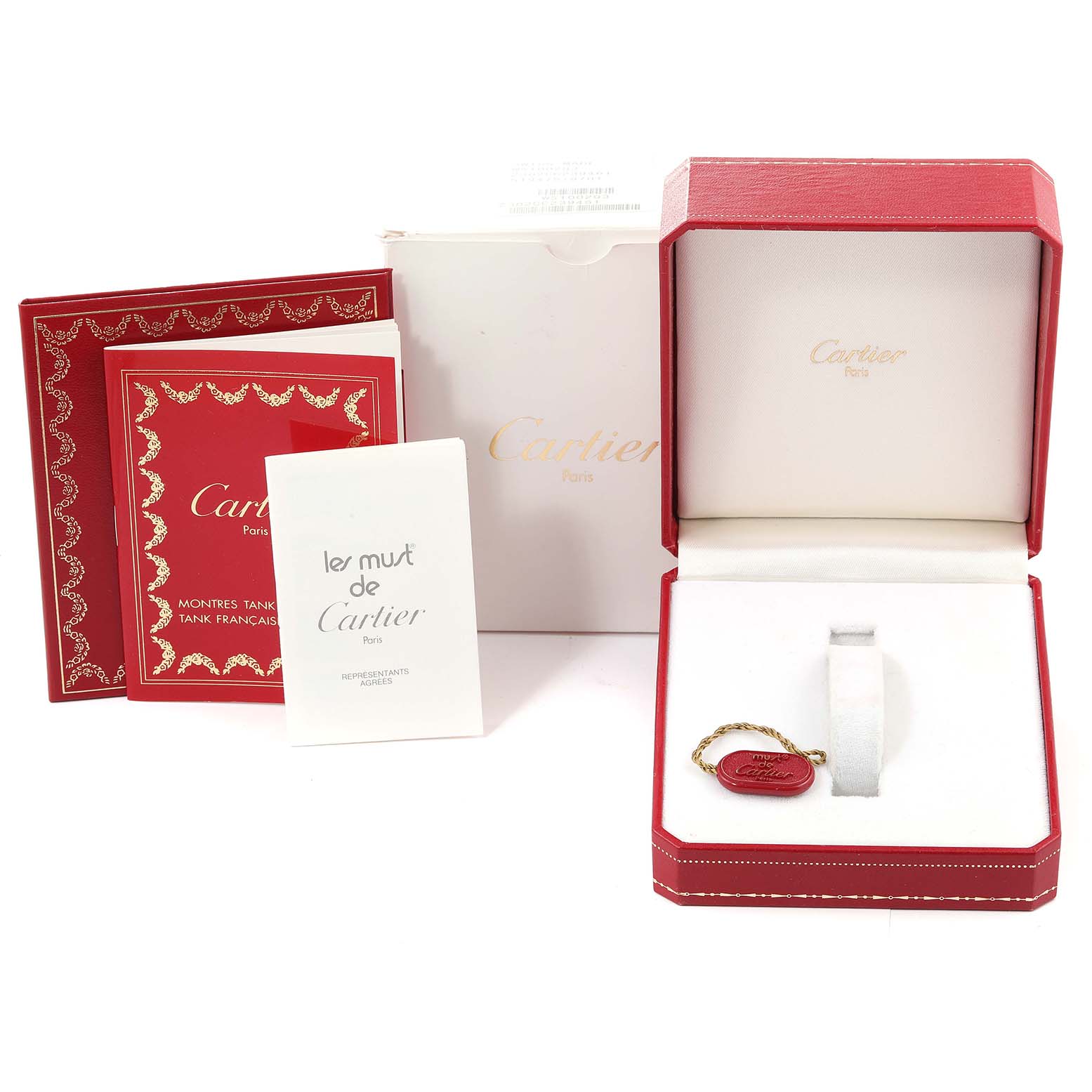 The image shows the packaging and accessories for a Cartier Tank Francaise W51002Q3 Men's Stainless Steel Silver Dial W51002Q3 Men's Stainless Steel Silver Dial watch, including the box, manual, and tags.