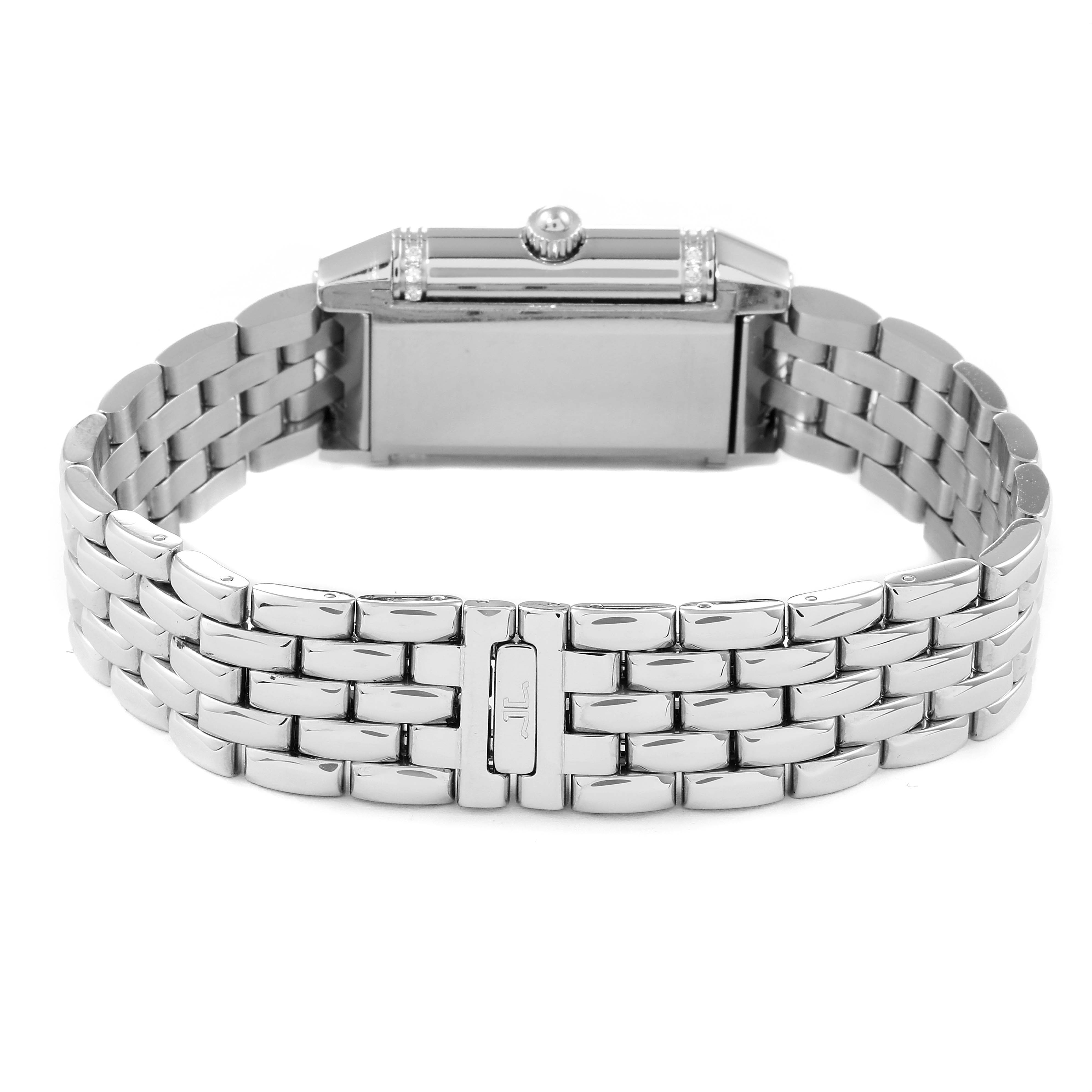 The image shows the back and side of a Jaeger-LeCoultre Reverso watch with a metal bracelet.