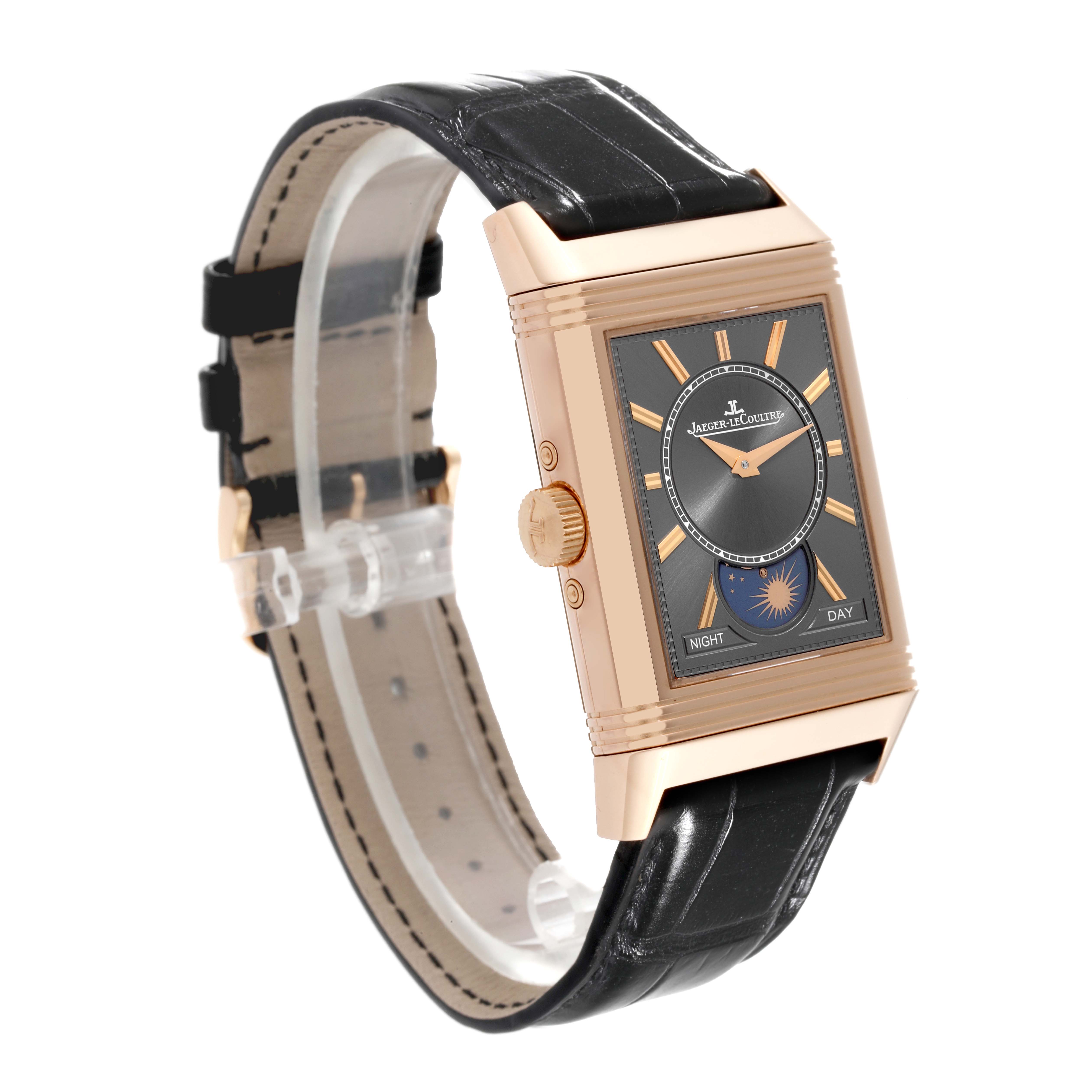 The Reverso model by Jaeger LeCoultre is shown at a three-quarter angle, highlighting the face, crown, and black leather strap.