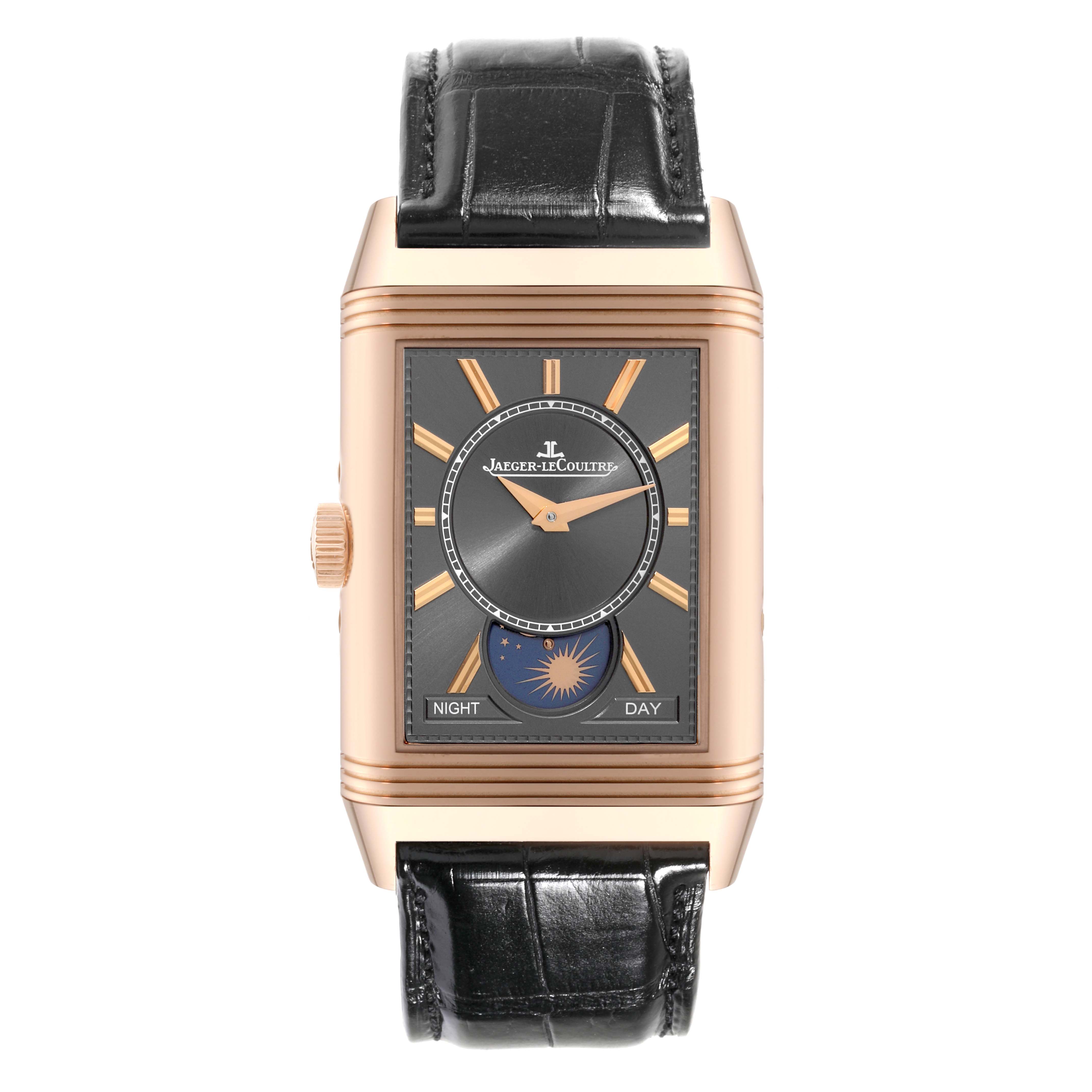 The image shows a front view of a Jaeger LeCoultre Reverso Q3912530 Men's Rose Gold Grey Dial Q3912530 Men's Rose Gold Grey Dial watch with a black strap and a day-night indicator.