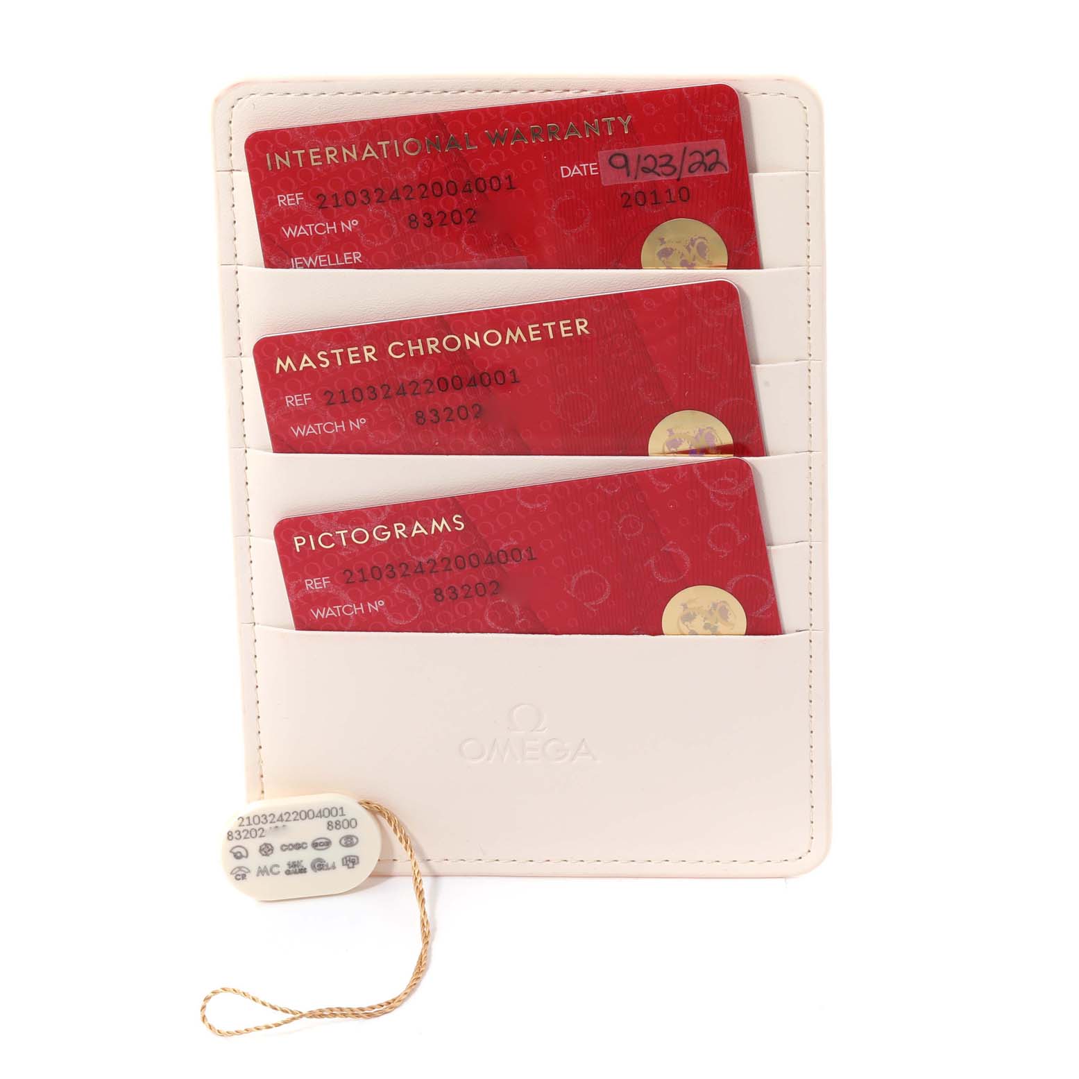 This image shows the warranty cards and accessories for an Omega Seamaster 210.32.42.20.04.001 Men
s Stainless Steel White Dial 210.32.42.20.04.001 Men
s Stainless Steel White Dial watch, neatly arranged in a holder.