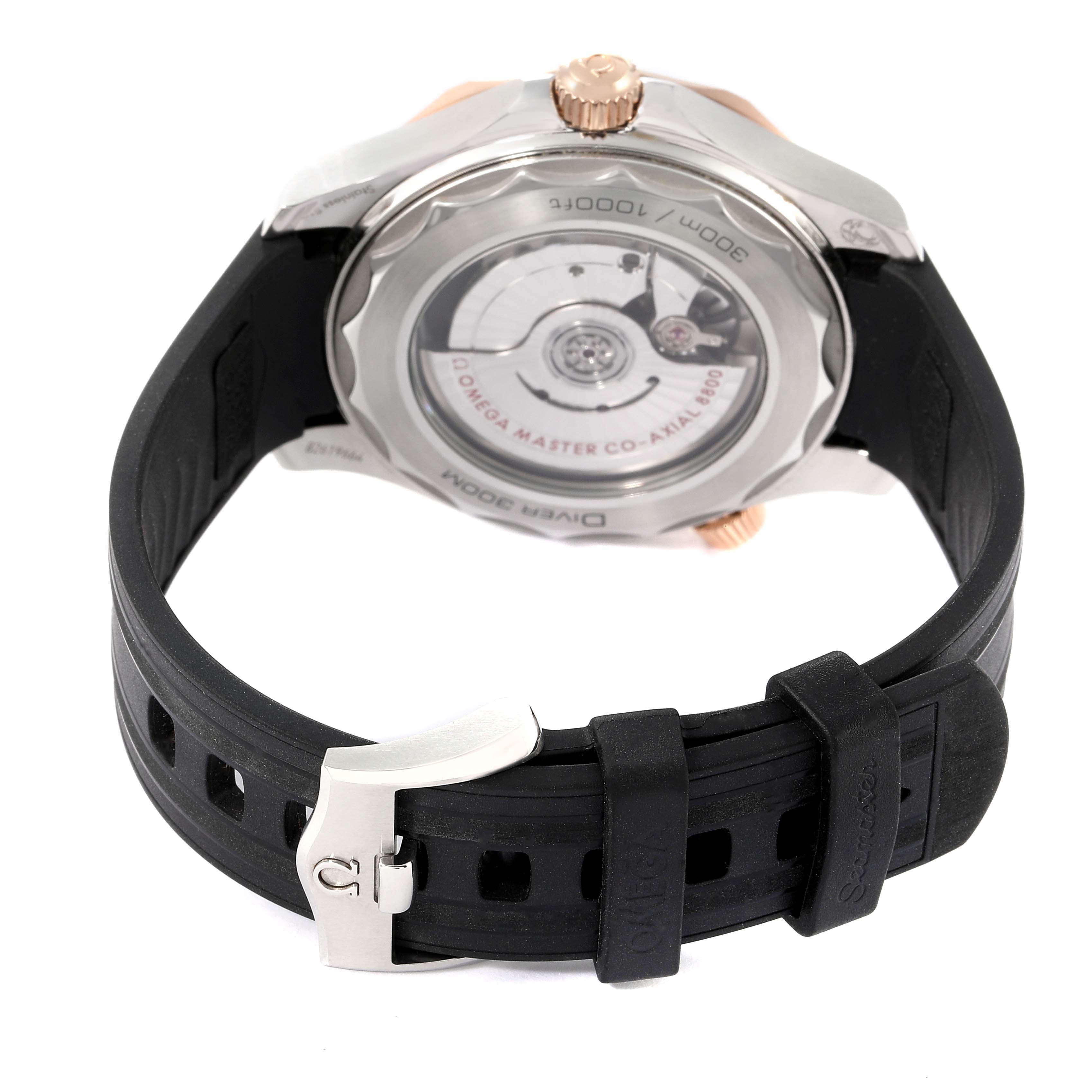 The image shows the back view of the Omega Seamaster 210.22.42.20.01.002 Men's Steel and Gold (two tone) Black Dial 210.22.42.20.01.002 Men's Steel and Gold (two tone) Black Dial, highlighting its exhibition case back and black rubber strap.