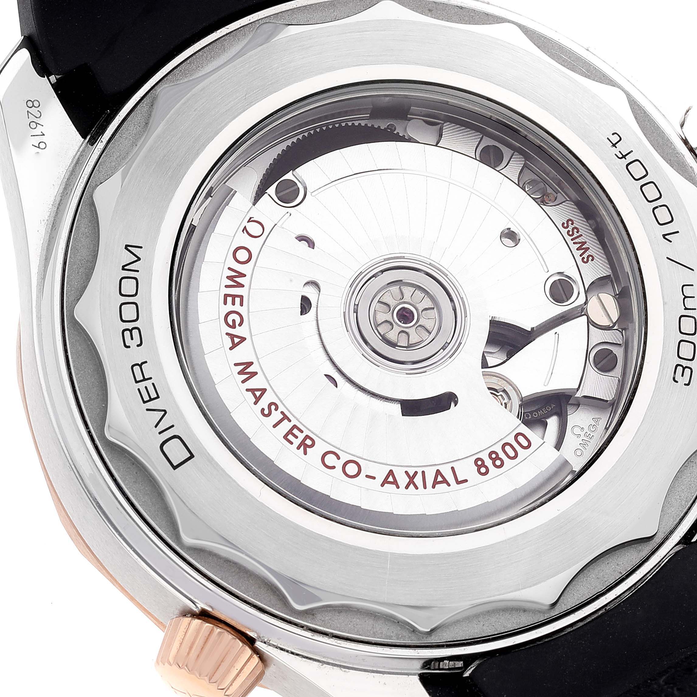 This is a close-up image of the back side of the Omega Seamaster 210.22.42.20.01.002 Men's Steel and Gold (two tone) Black Dial 210.22.42.20.01.002 Men's Steel and Gold (two tone) Black Dial watch, showing the movement and rotor.