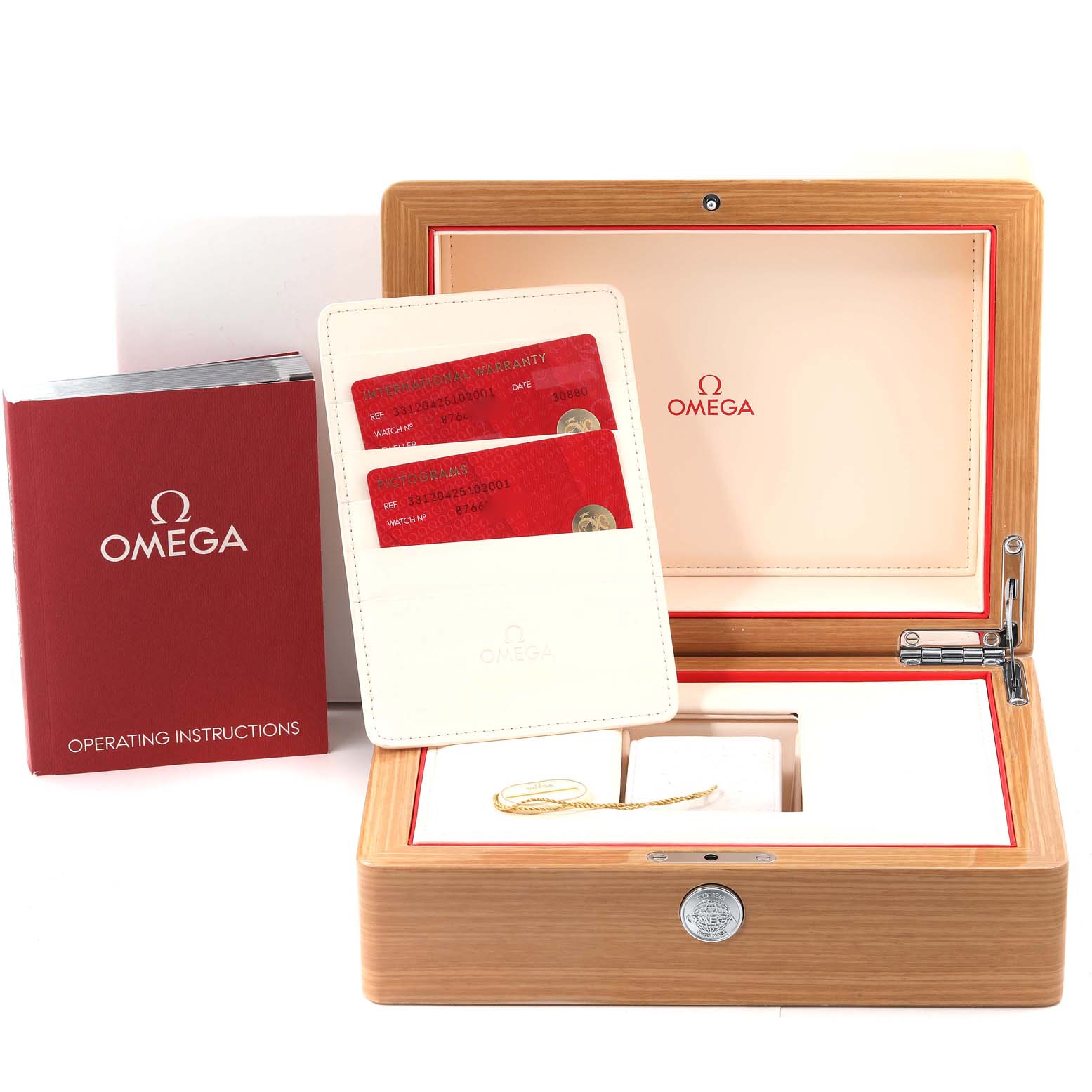 The image shows an open Omega Speedmaster 331.20.42.51.02.001 Men's Steel and Gold (two tone) White Dial 331.20.42.51.02.001 Men's Steel and Gold (two tone) White Dial watch box, warranty cards, and operating instructions booklet.