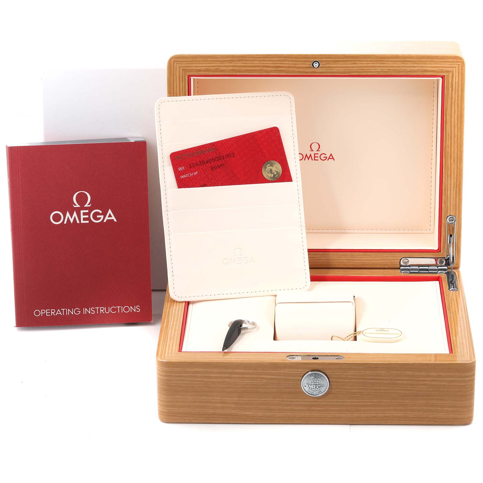 The image shows the packaging for an Omega Speedmaster 326.30.40.50.01.002 Men
s Stainless Steel Black Dial 326.30.40.50.01.002 Men
s Stainless Steel Black Dial watch, including the box, operating instructions booklet, cardholder, and additional accessories.