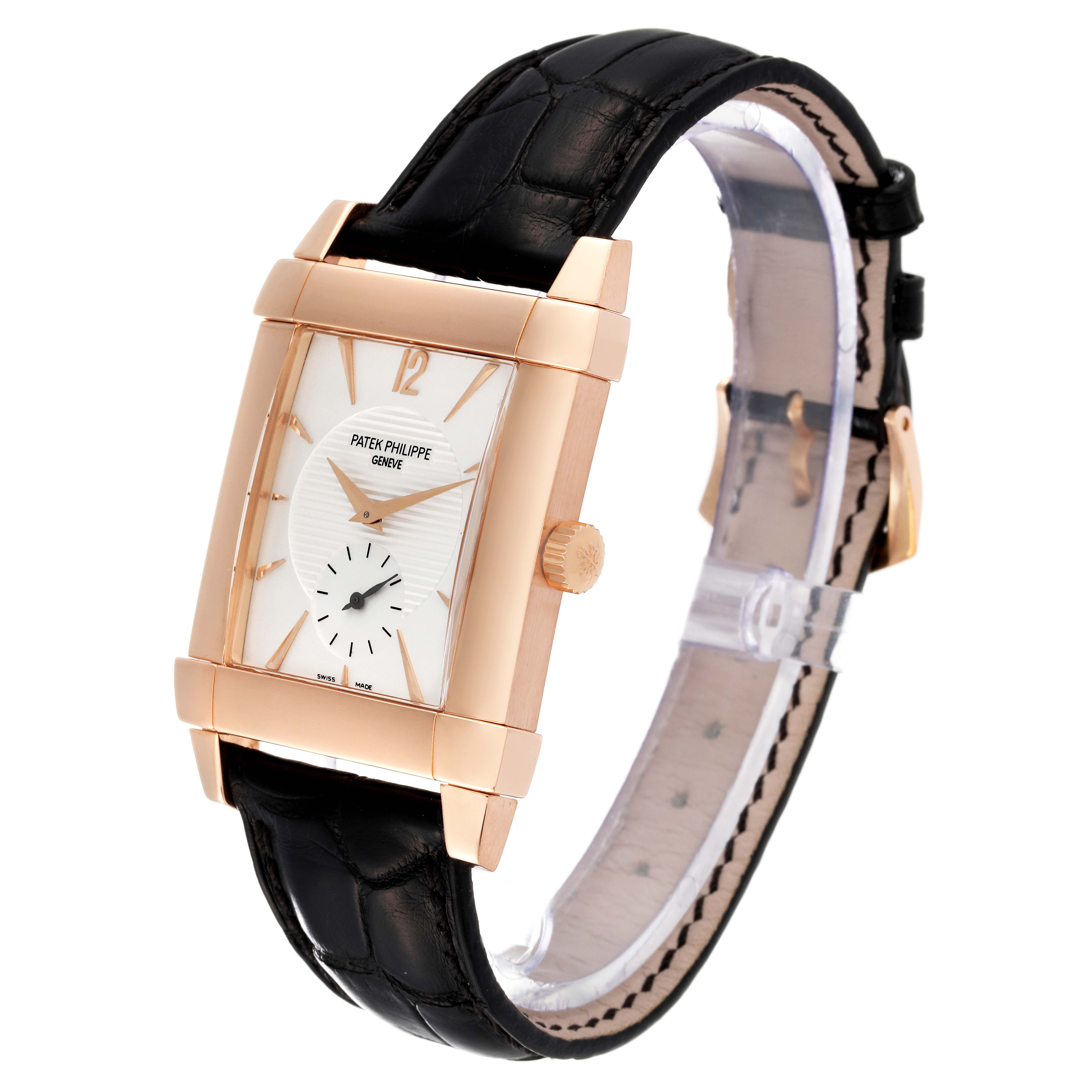 The image shows a Patek Philippe Gondolo 5111R Men
s Rose Gold Silver Dial 5111R Men
s Rose Gold Silver Dial watch at an angle, highlighting its dial, crown, and leather strap.