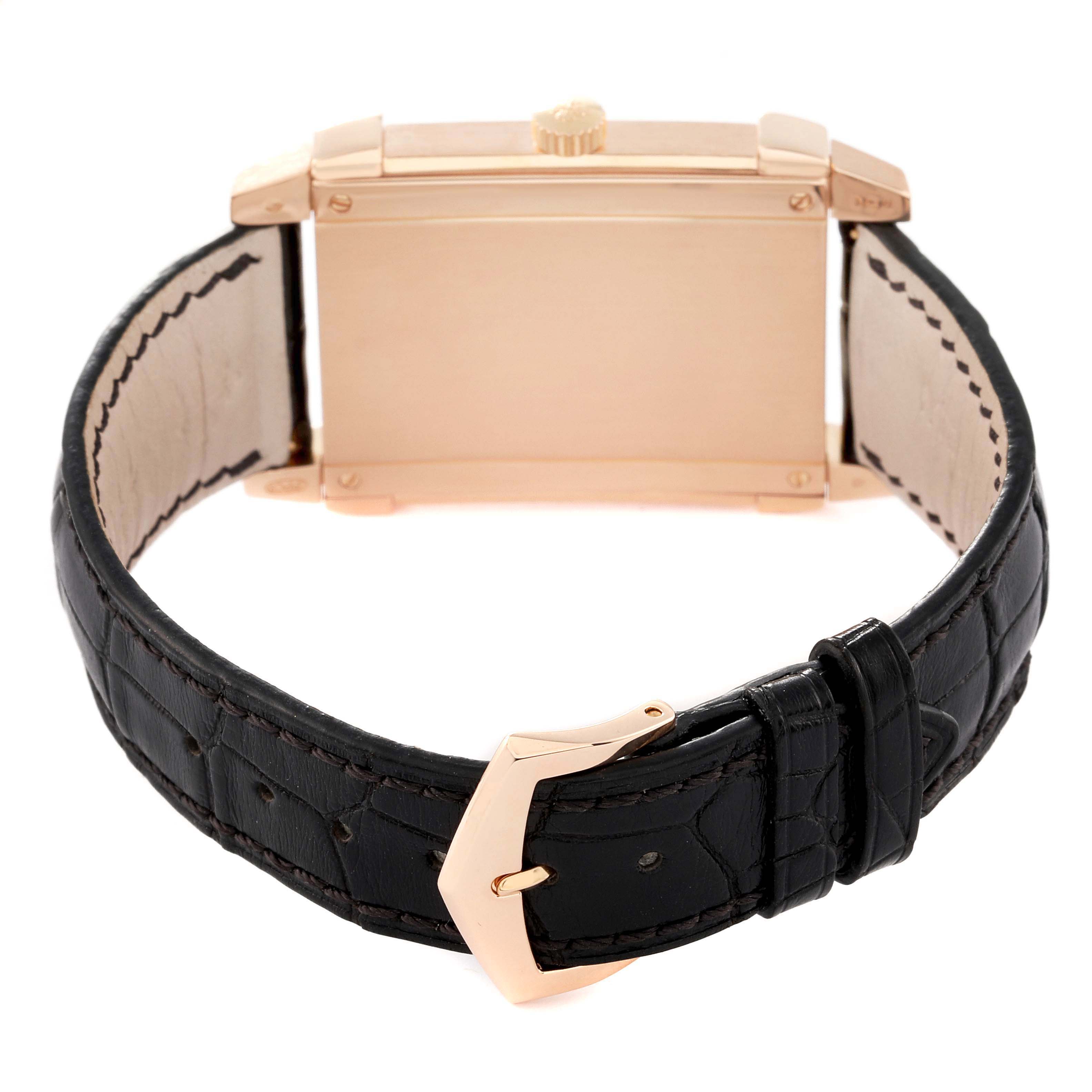 The image shows the back view of the Patek Philippe Gondolo 5111R Men
s Rose Gold Silver Dial 5111R Men
s Rose Gold Silver Dial watch, highlighting its rectangular case and black leather strap with a clasp.