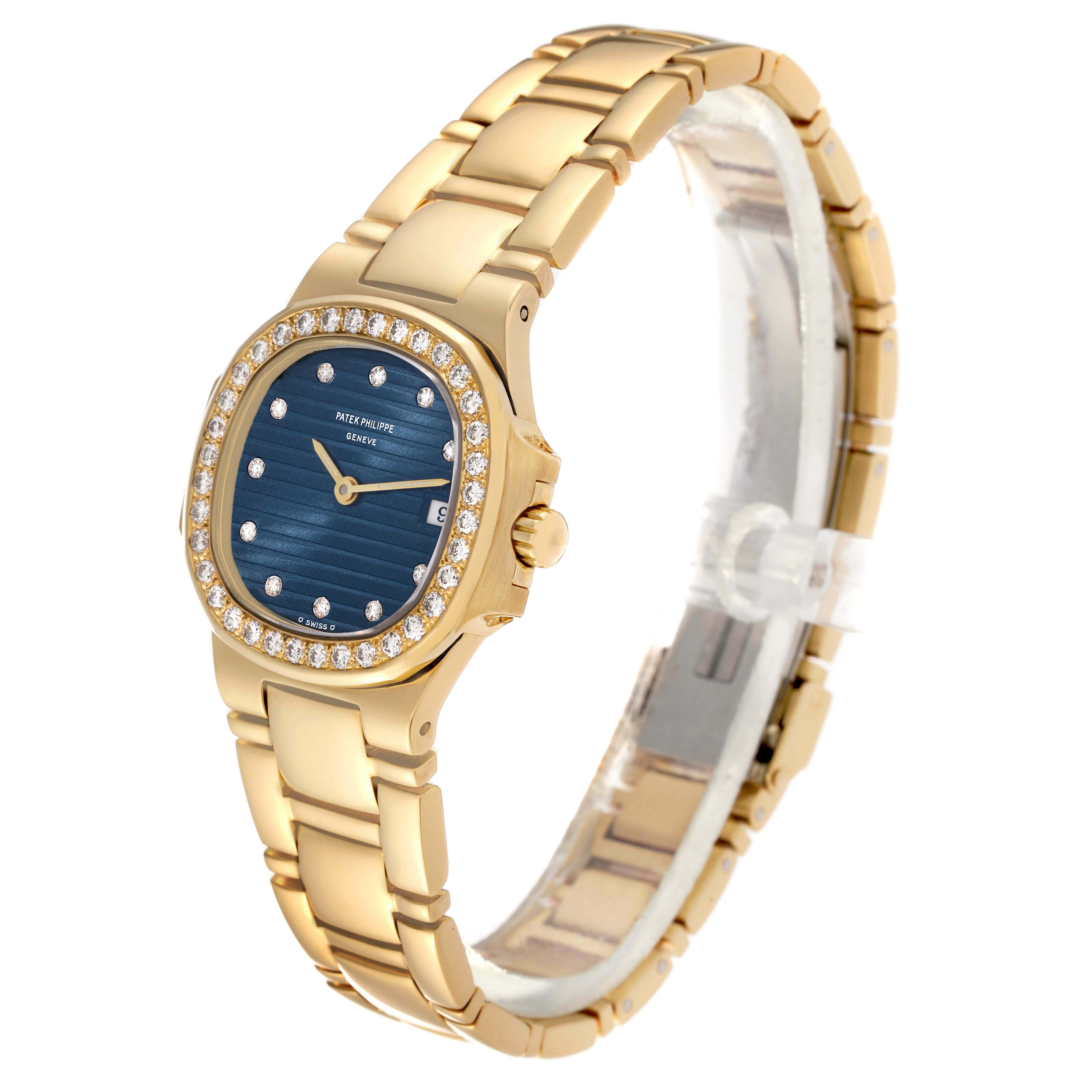 The image shows a Patek Philippe Nautilus 4700 Women's Yellow Gold Black Dial 4700 Women's Yellow Gold Black Dial watch in a side-angle view, highlighting its gold bracelet, blue dial, and diamond bezel.