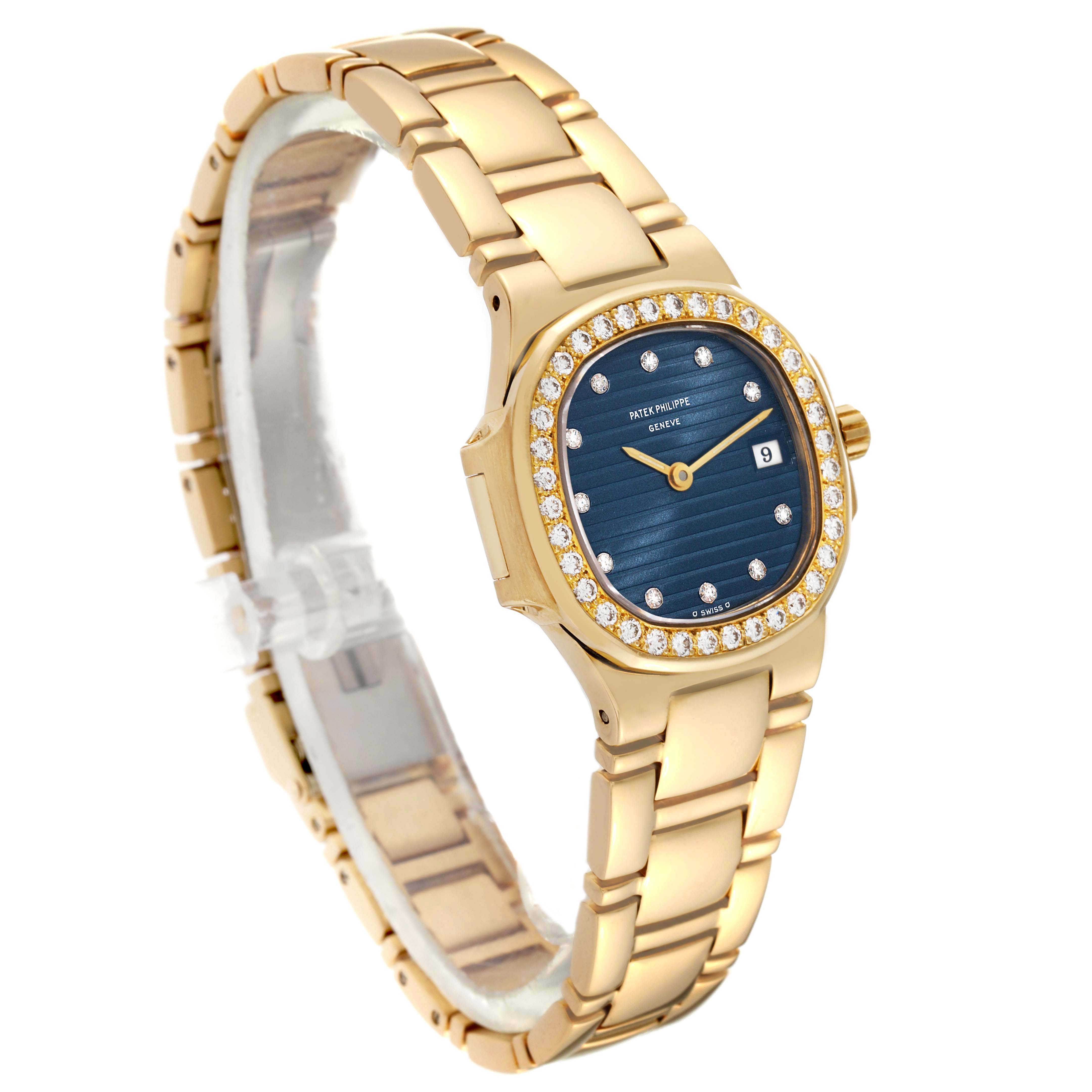 This image shows a side angle of a Patek Philippe Nautilus 4700 Women's Yellow Gold Black Dial 4700 Women's Yellow Gold Black Dial watch, highlighting the gold bracelet, diamond bezel, and blue dial.