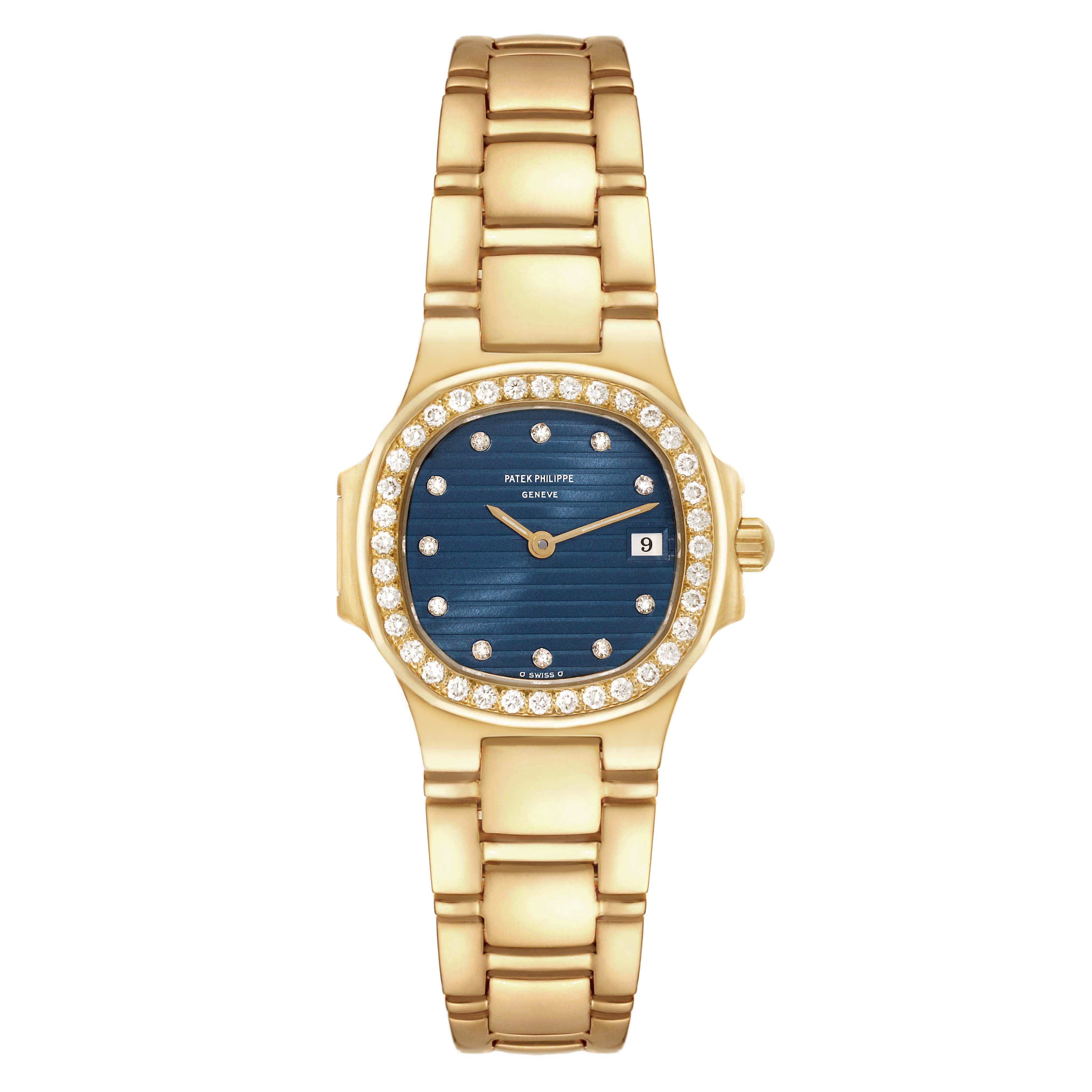 The image shows a Patek Philippe Nautilus 4700 Women's Yellow Gold Black Dial 4700 Women's Yellow Gold Black Dial watch from a top-down angle, highlighting its blue dial, diamond bezel, gold case, and bracelet.