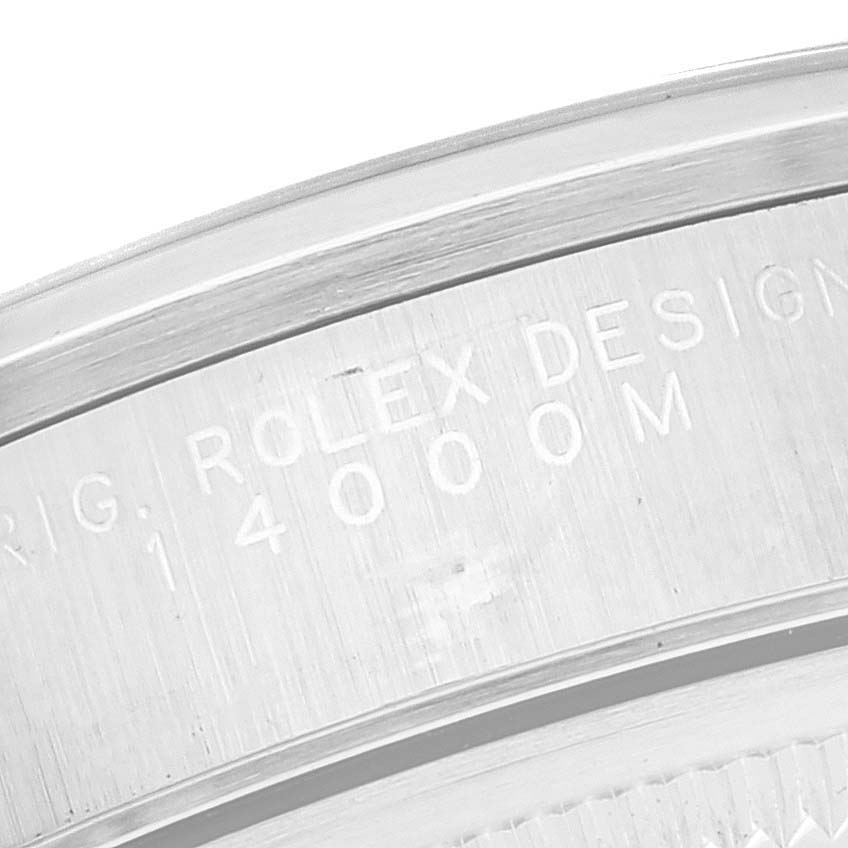 This image shows a close-up of the inner bezel of the Rolex Air-King 14000 Men's Stainless Steel Black Dial 14000 Men's Stainless Steel Black Dial, displaying part of the engraved model number "14000M".