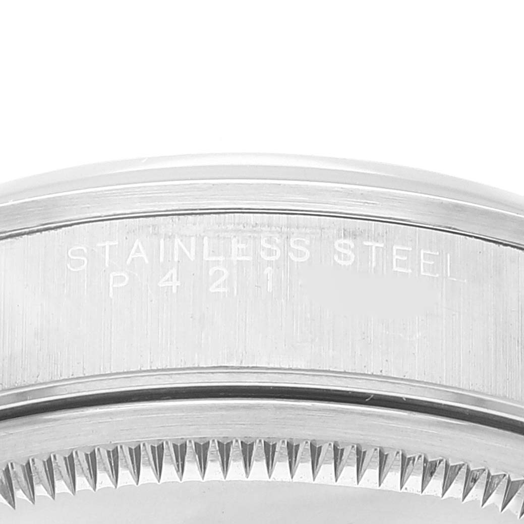 This image shows a close-up of the side of a stainless steel casing with engravings for a Rolex Air-King 14000 Men's Stainless Steel Silver Dial 14000 Men's Stainless Steel Silver Dial watch.