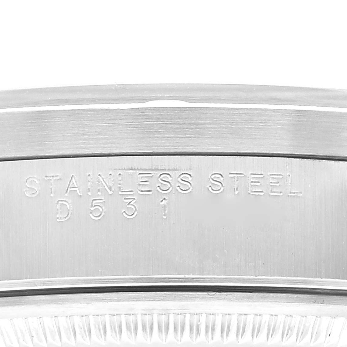 This close-up image shows the engraving on the stainless steel bezel of a Rolex Air-King 14010 Men's Stainless Steel Blue Dial 14010 Men's Stainless Steel Blue Dial watch.