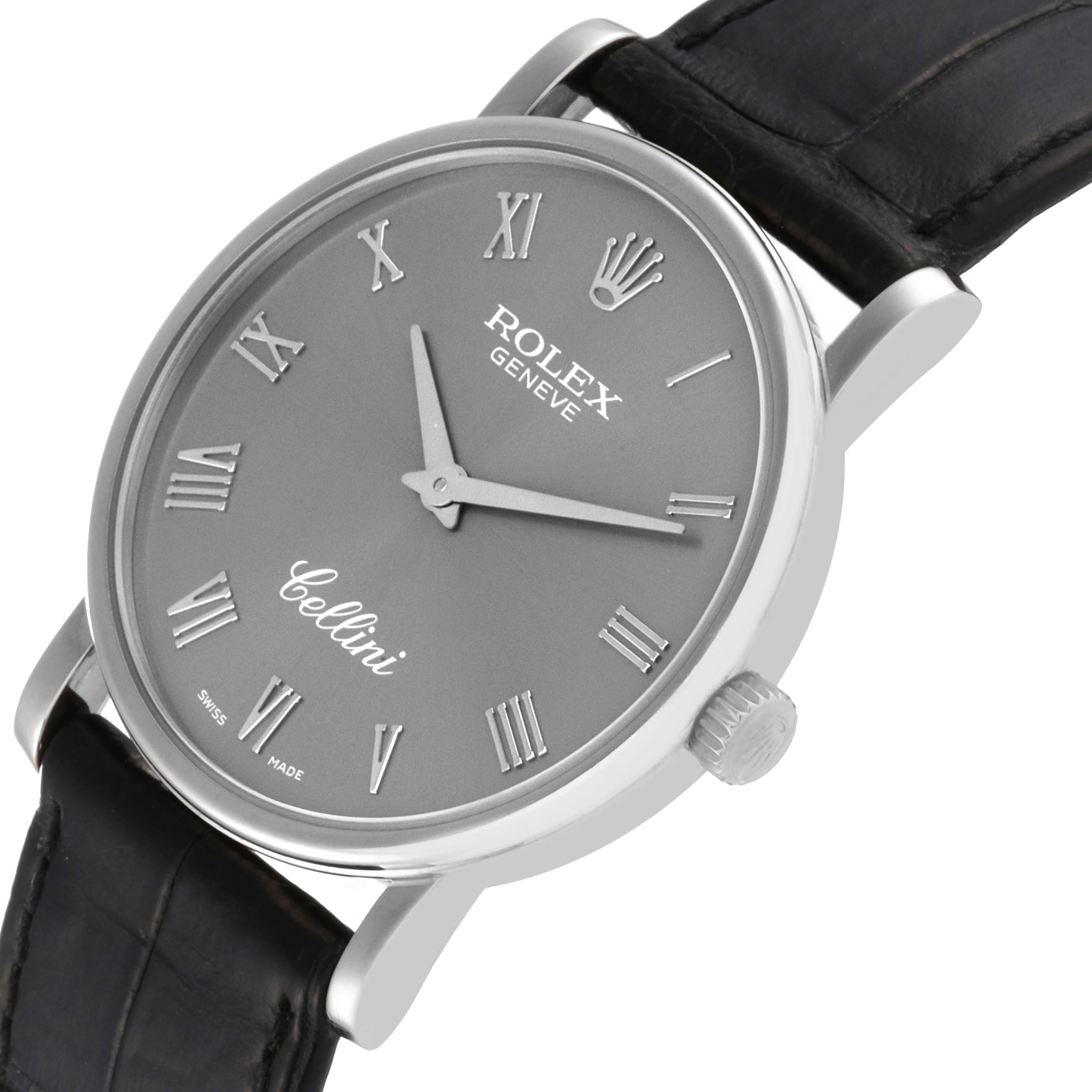 The Rolex Cellini 5115 Men's White Gold Grey Dial 5115 Men's White Gold Grey Dial watch is shown at a slightly tilted angle, displaying its face, crown, lugs, and leather strap.