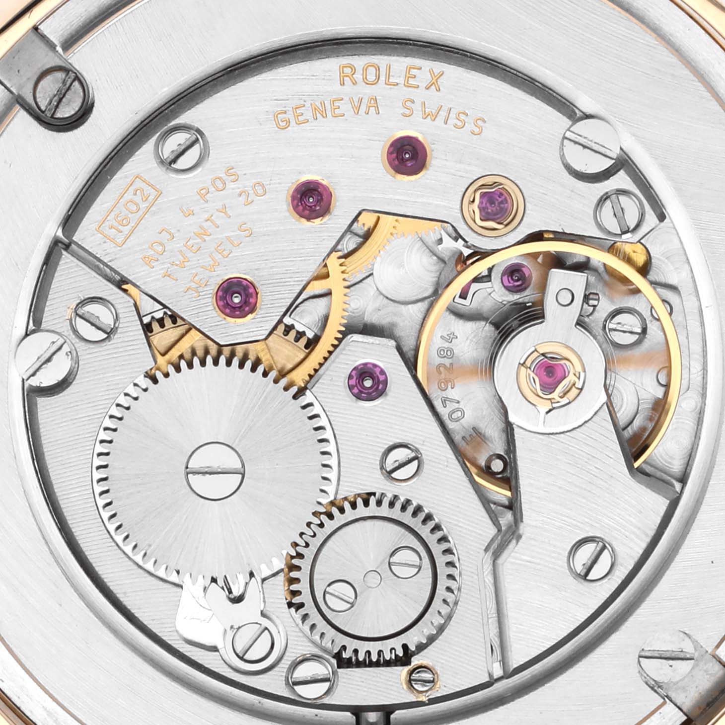 The image shows a close-up view of the movement's internal mechanism of a Rolex Cellini 5115 Men's Yellow Gold Champagne Dial 5115 Men's Yellow Gold Champagne Dial watch, revealing gears and jeweled pivots.