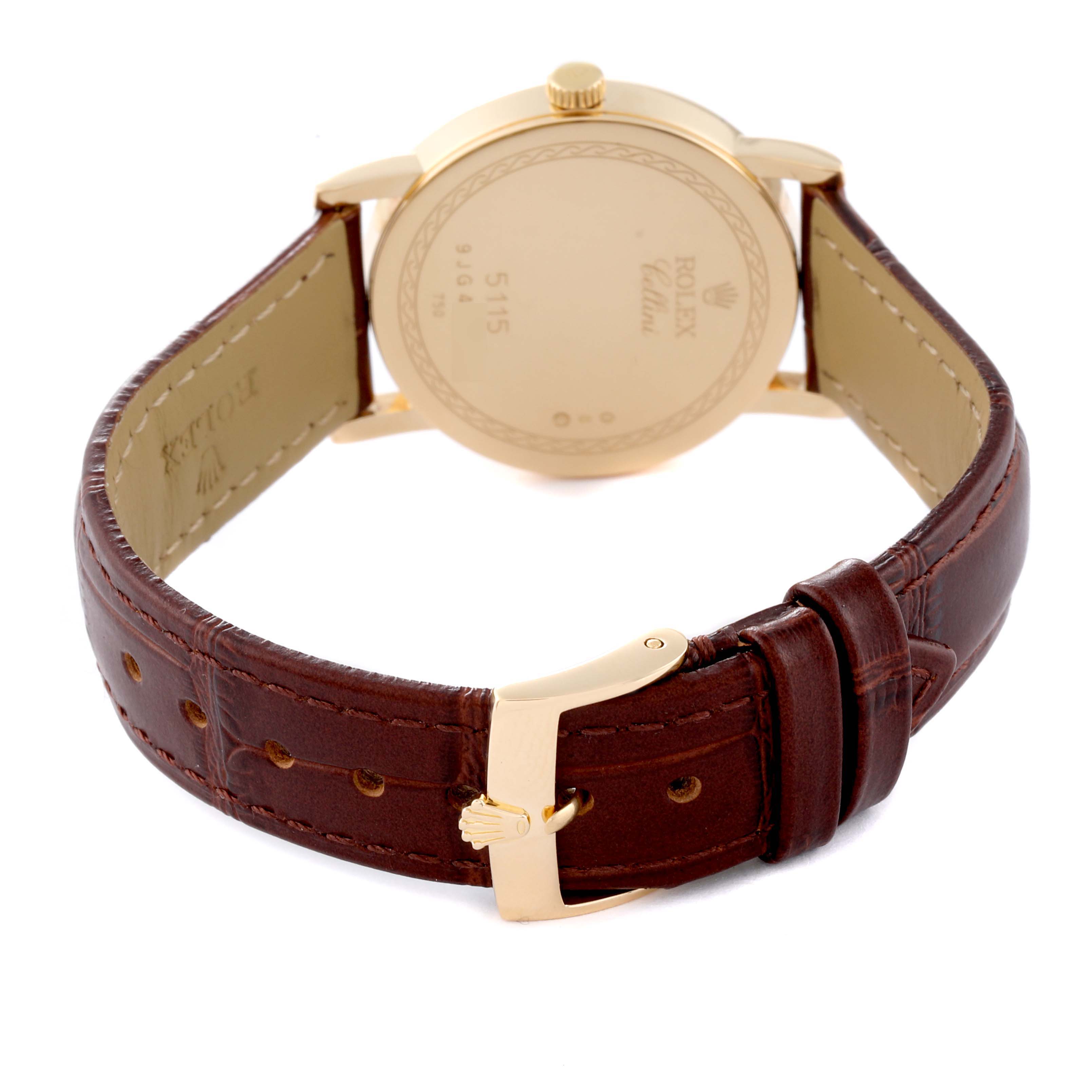 The image shows the back of a Rolex Cellini 5115/8 Men's Yellow Gold White Dial 5115/8 Men's Yellow Gold White Dial model watch, featuring its case back, crown, and leather strap with a buckle.