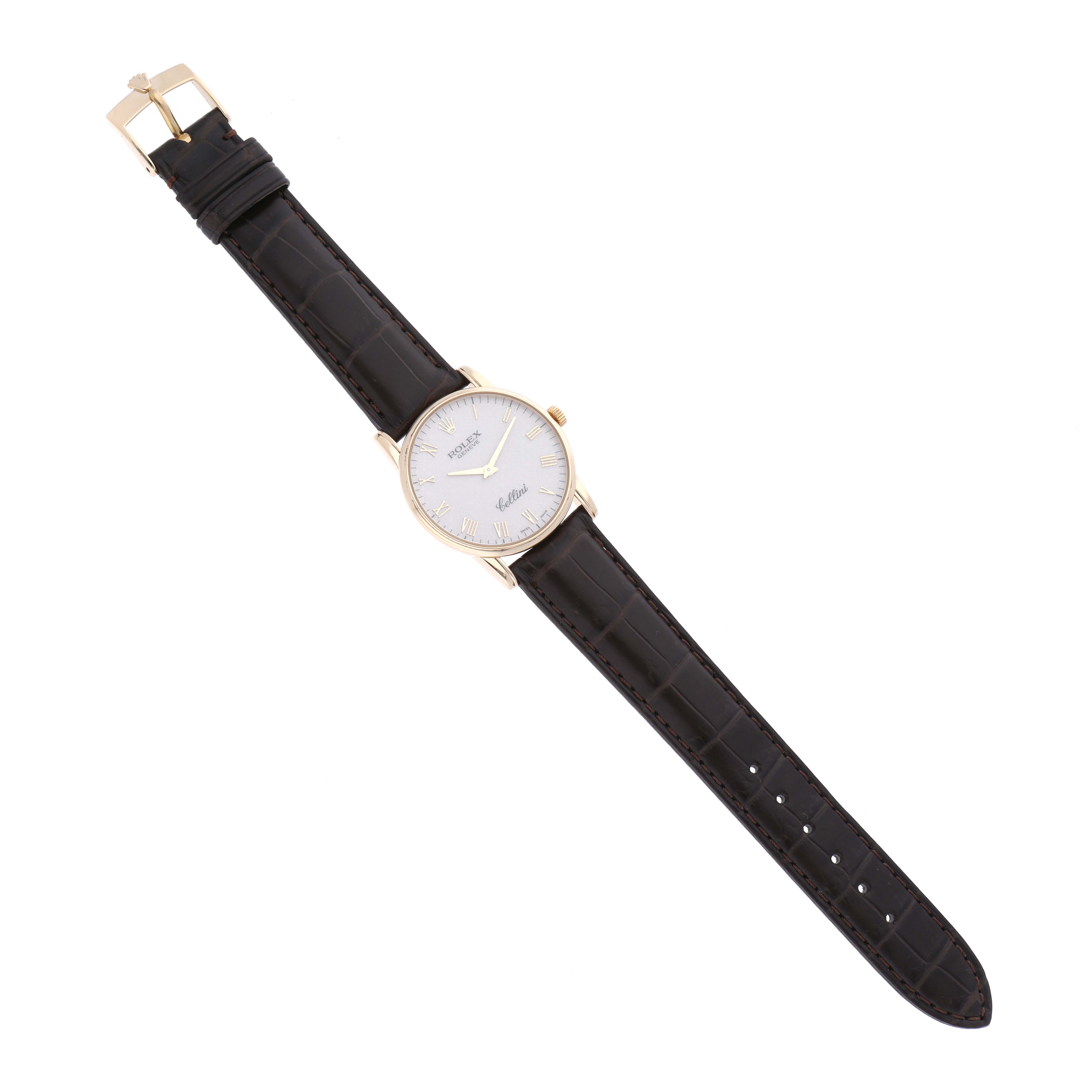 The Rolex Cellini 5116/8 Men's Yellow Gold White Dial 5116/8 Men's Yellow Gold White Dial watch is shown in a flat, top-down angle, displaying its dial, case, and leather strap.