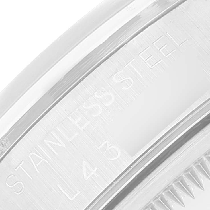 This image shows a close-up of the serial number and "STAINLESS STEEL" engraving on the case back of a Rolex Date 15200 Men
s Stainless Steel Black Dial 15200 Men
s Stainless Steel Black Dial model watch.