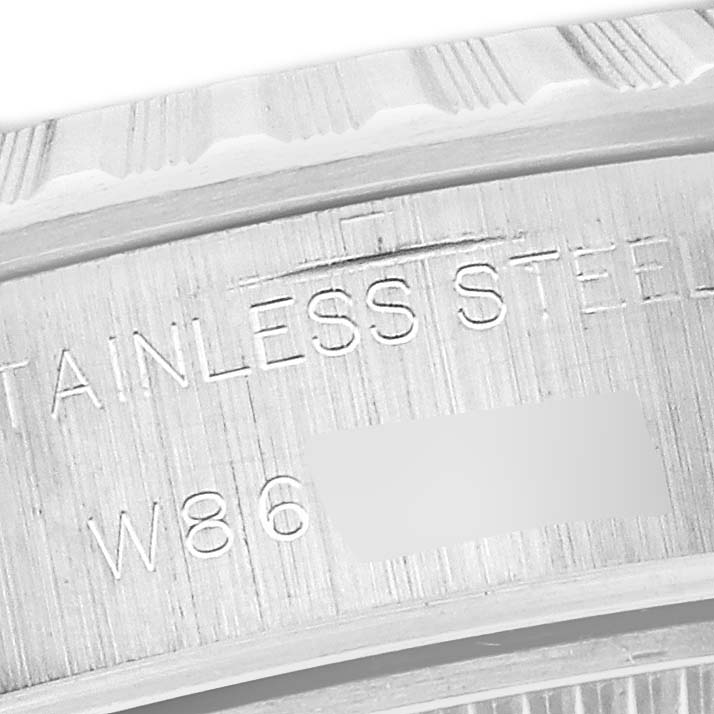 The image shows a close-up angle of the stainless steel casing of a Rolex Date 69240 Women
s Stainless Steel Blue Dial 69240 Women
s Stainless Steel Blue Dial model watch.