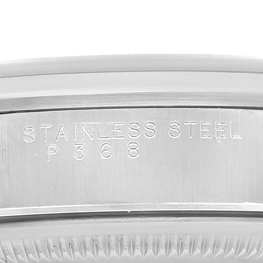 This image shows a close-up of the engraved stainless steel case of a Rolex Date 15200 Men's Stainless Steel Blue Dial 15200 Men's Stainless Steel Blue Dial watch.