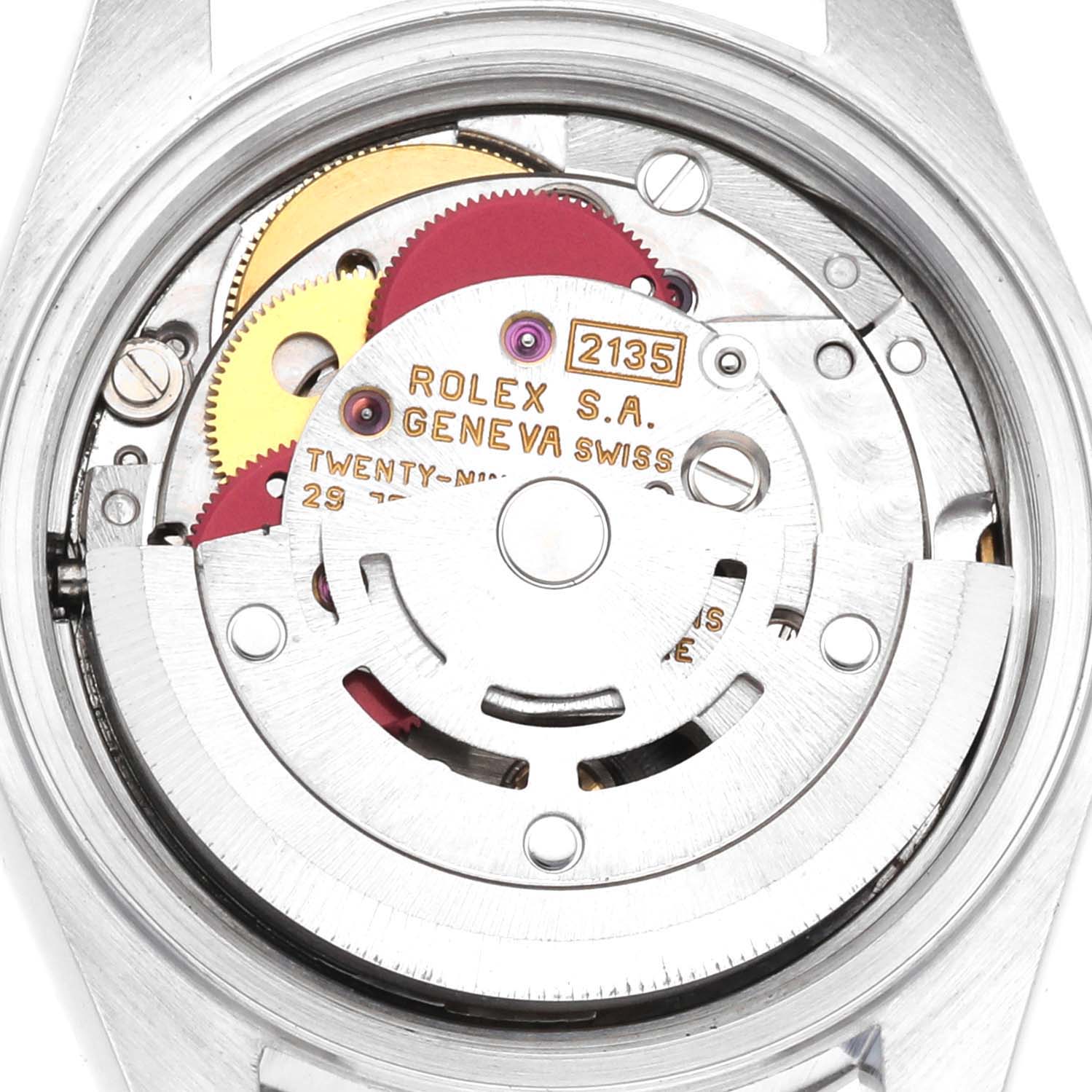 This image shows an up-close view of the internal mechanism of a Rolex Date 69160 Women's Stainless Steel Blue Dial 69160 Women's Stainless Steel Blue Dial model watch, revealing gears and components.