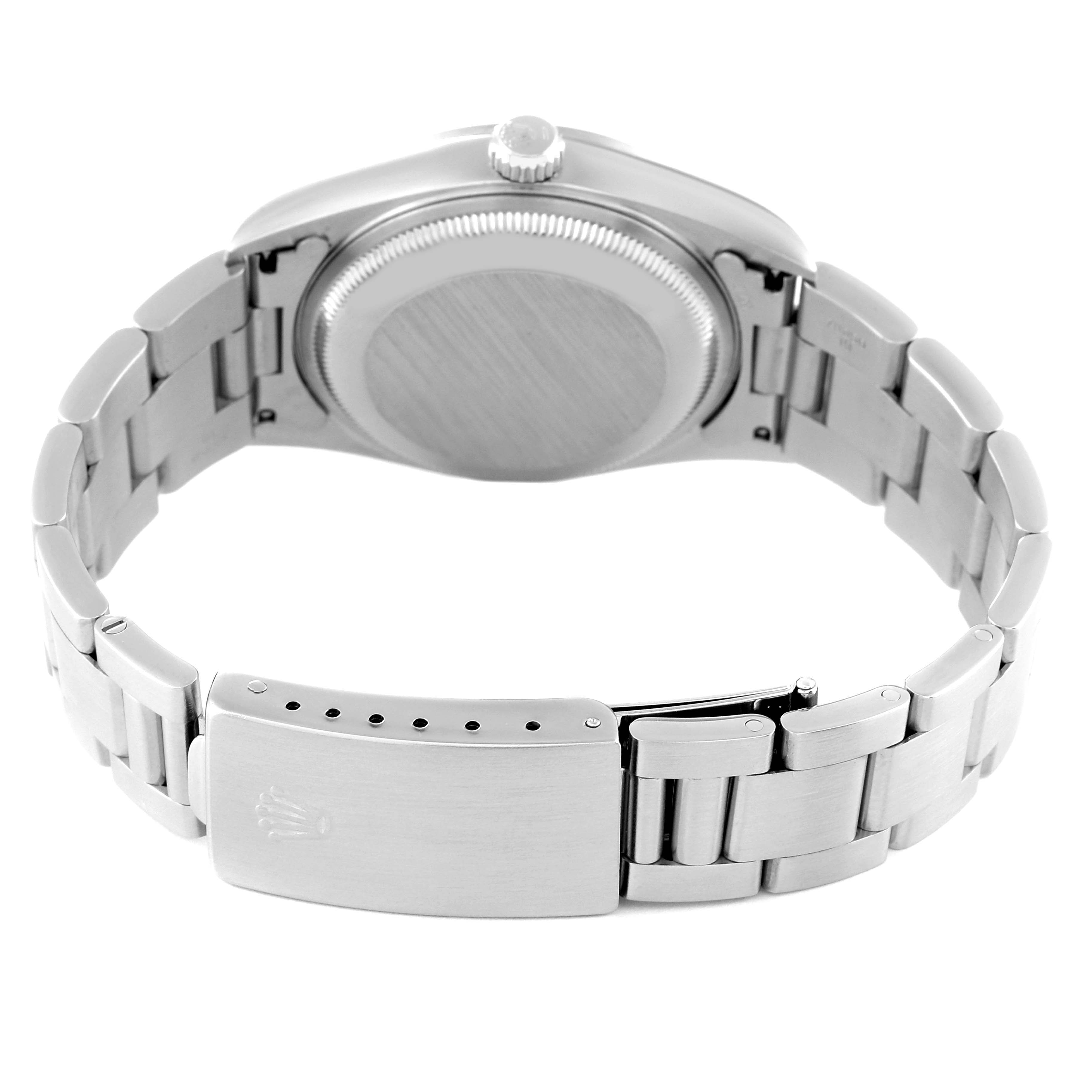 This image shows the back view of a Rolex Date 15200 Men
s Stainless Steel White Dial 15200 Men
s Stainless Steel White Dial watch, focusing on the case back, crown, and the metallic bracelet with the clasp.