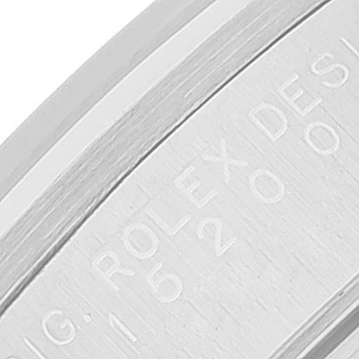 This close-up image shows the inner band of a Rolex Date 15200 Men's Stainless Steel Silver Dial 15200 Men's Stainless Steel Silver Dial model watch engraved with text.