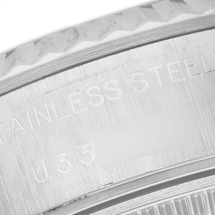 This close-up image shows the engraved stainless steel case back of a Rolex Datejust 69174 Women's Stainless Steel Black Dial 69174 Women's Stainless Steel Black Dial watch.