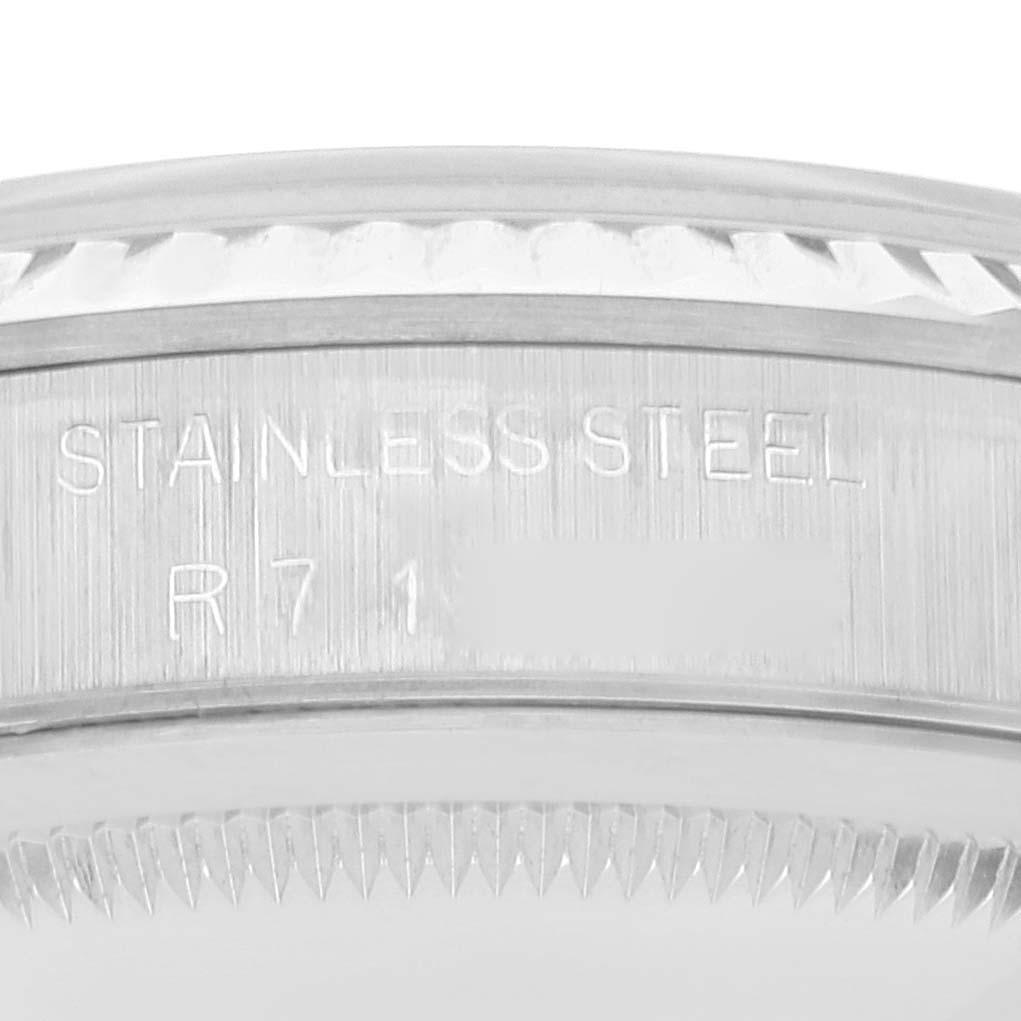 This close-up image shows the engraved stainless steel case back edge of a Rolex Datejust 16234 Men's Stainless Steel Black Dial 16234 Men's Stainless Steel Black Dial watch.