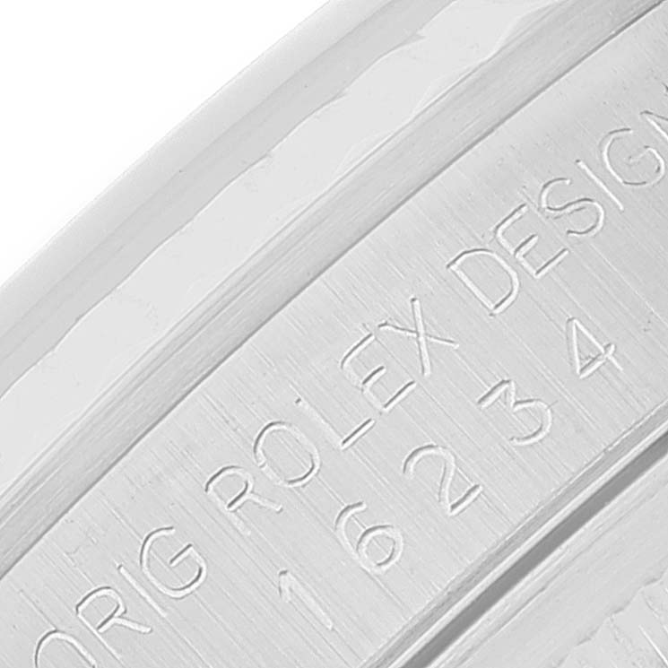 This close-up image shows the engraved inner bezel of a Rolex Datejust 16234 Men's Stainless Steel Blue Dial 16234 Men's Stainless Steel Blue Dial.