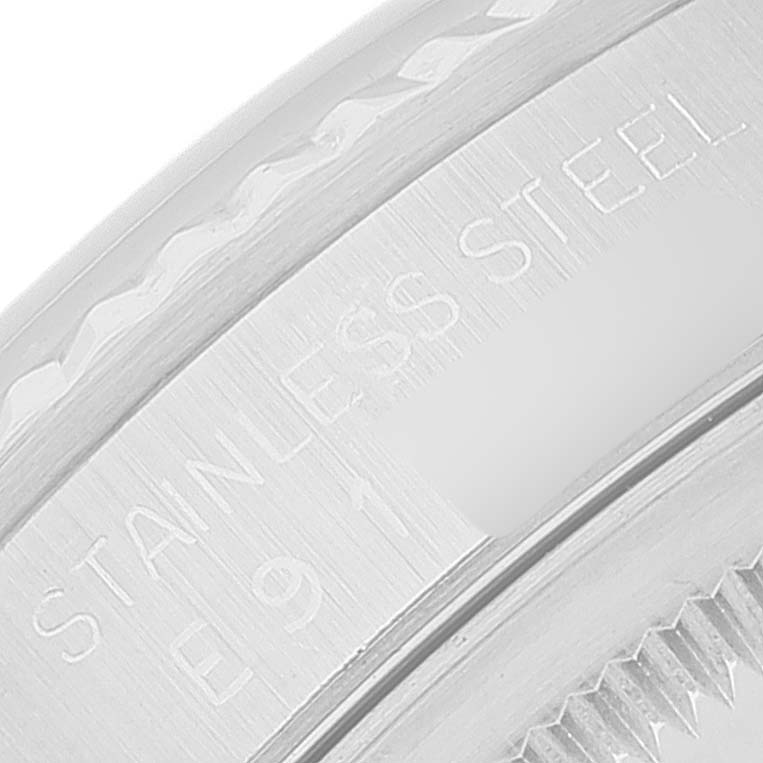 This image shows a close-up of the bezel and case back lettering indicating "Stainless Steel" on a Rolex Datejust 16234 Men's Stainless Steel Blue Dial 16234 Men's Stainless Steel Blue Dial watch.