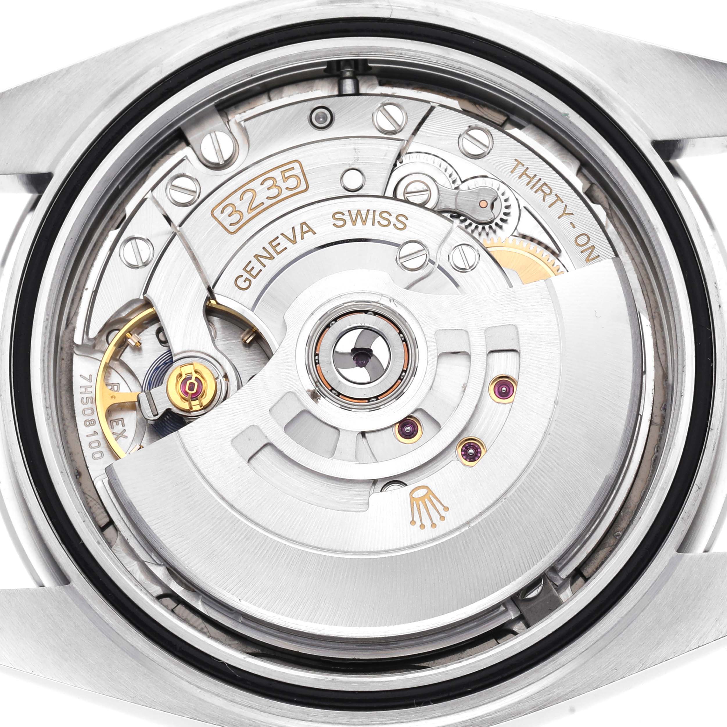 The image shows the movement inside the Rolex Datejust 41, model number 126300, highlighting the intricate mechanics and "3235" caliber markings.