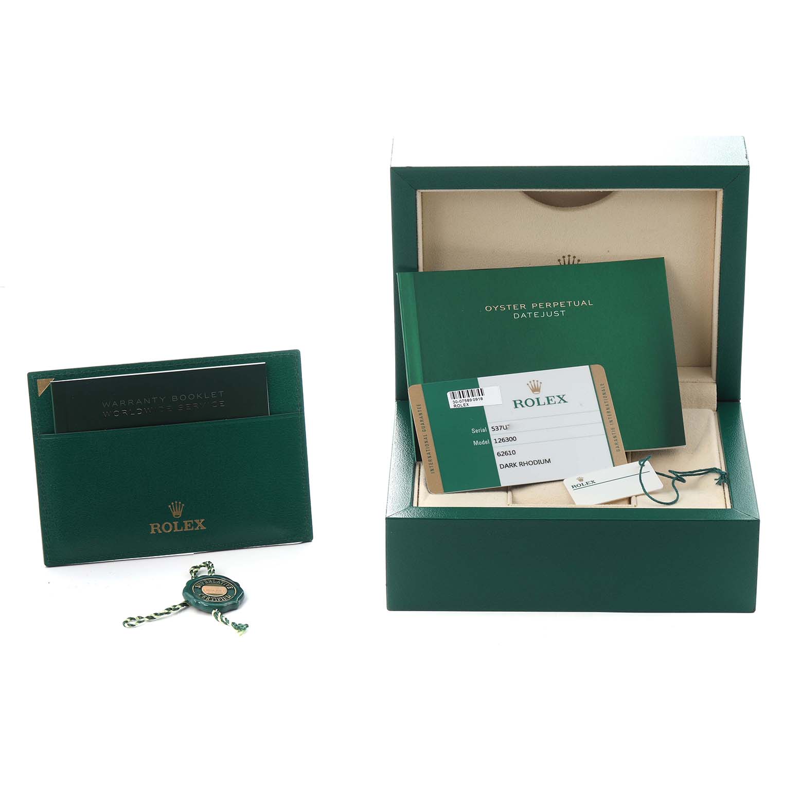 The image shows packaging and accessories, including a green cardholder, warranty booklet, and tags, for a Rolex Datejust 41, model 126300 men's watch.