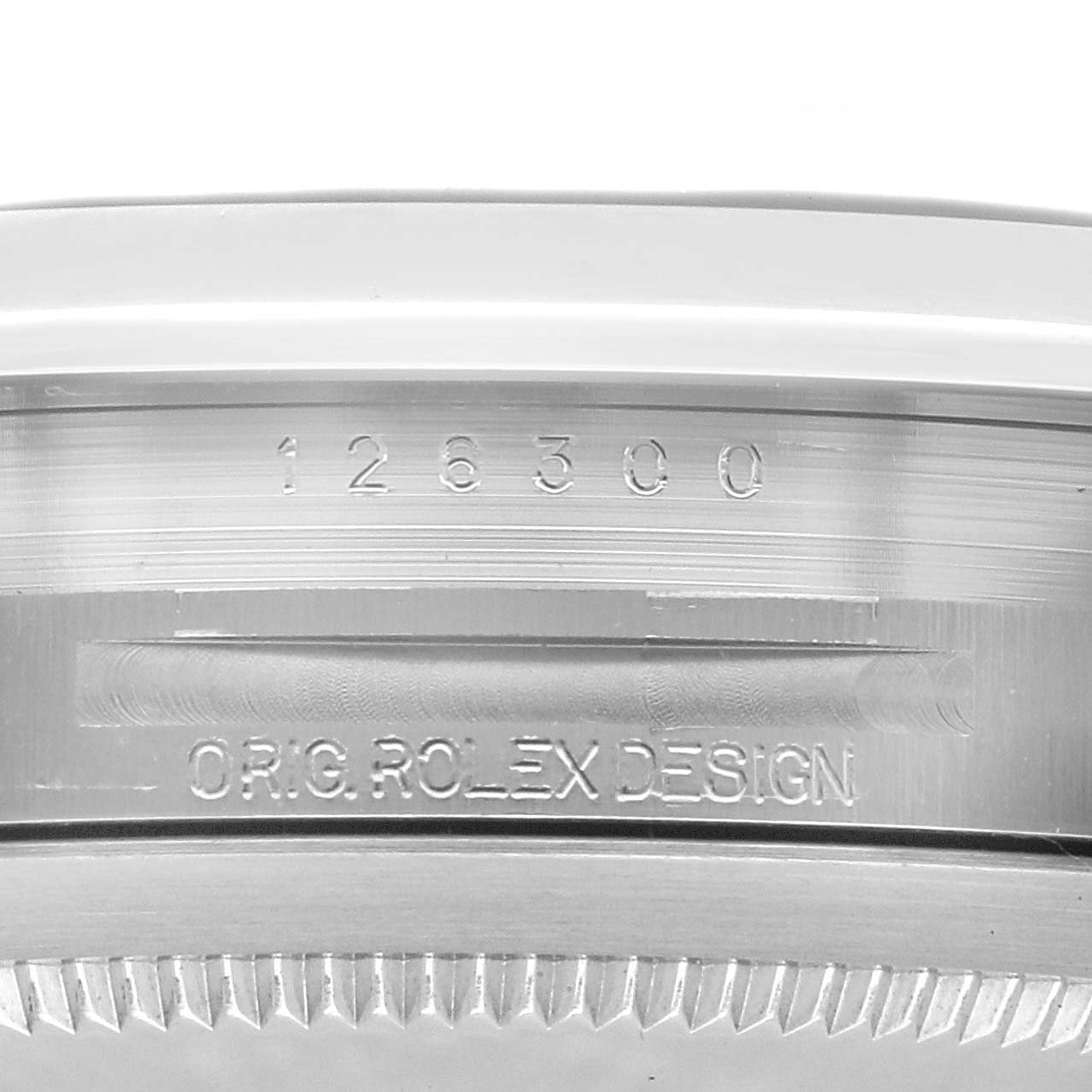The image shows a close-up view of the side of a Rolex Datejust 41, model number 126300, focusing on the engraved design details on the case.