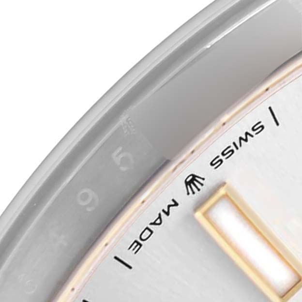 The image shows a close-up of the Rolex Datejust 41 model 126303, highlighting the edge of the dial, Swiss Made inscription, and part of a luminous marker.