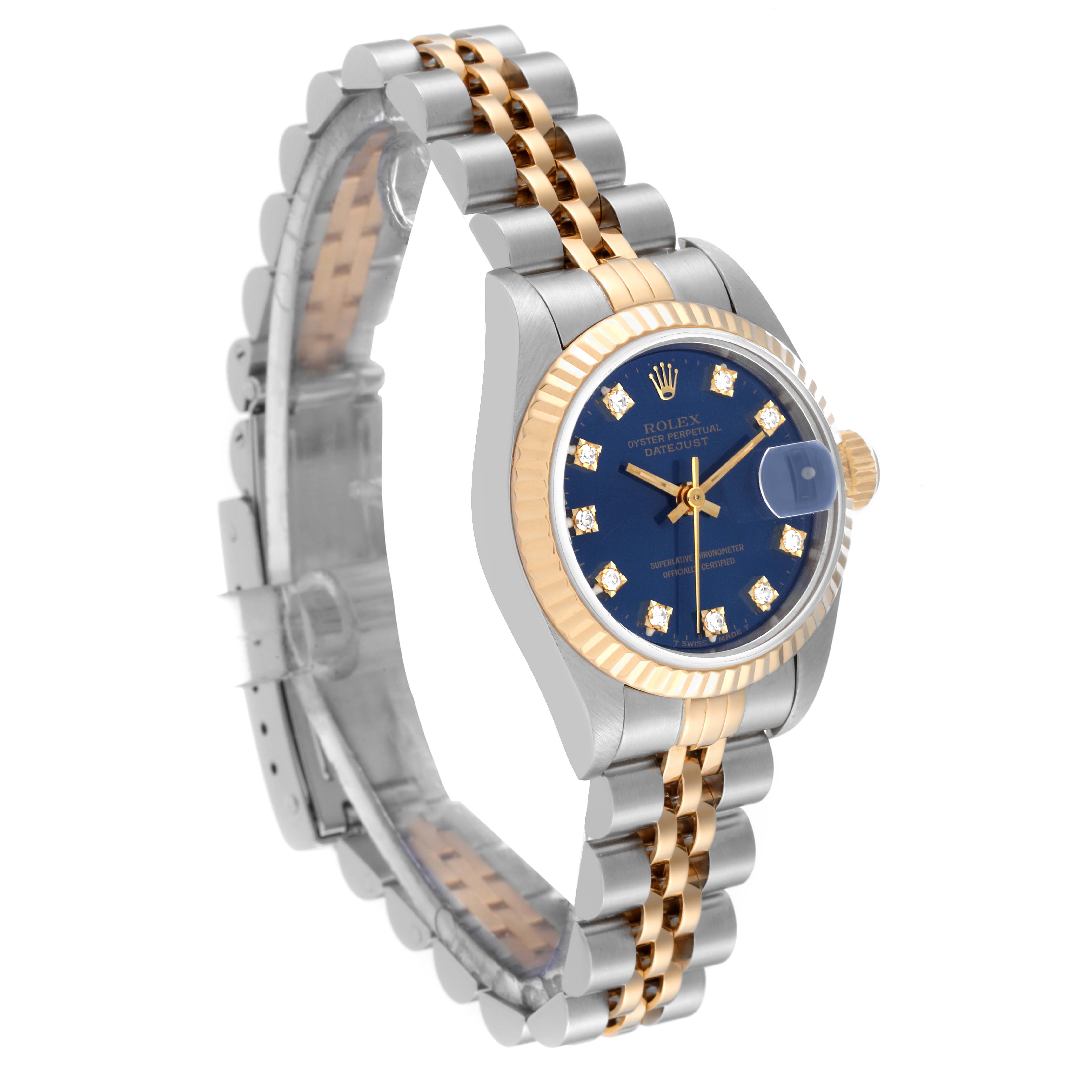 This Rolex Datejust 69173 Women's Steel and Gold (two tone) Blue Dial 69173 Women's Steel and Gold (two tone) Blue Dial watch is shown at a slight angle, highlighting its two-tone bracelet, blue dial, diamond hour markers, and fluted bezel.
