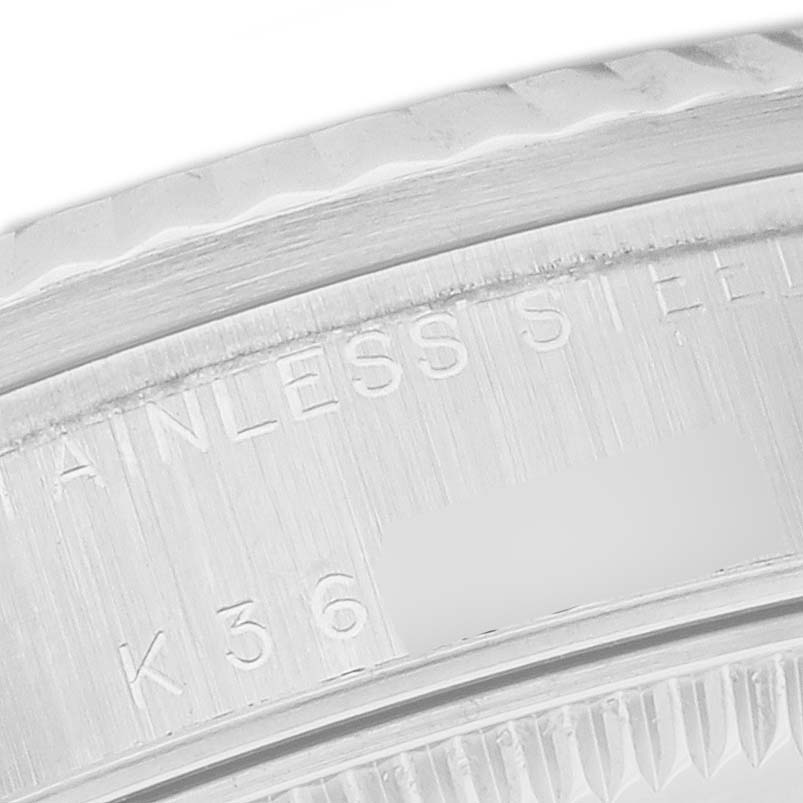 This close-up image shows the engraved inner bezel and part of the fluted bezel of a Rolex Mid-Size 78274 Women's Stainless Steel Silver Dial 78274 Women's Stainless Steel Silver Dial watch.