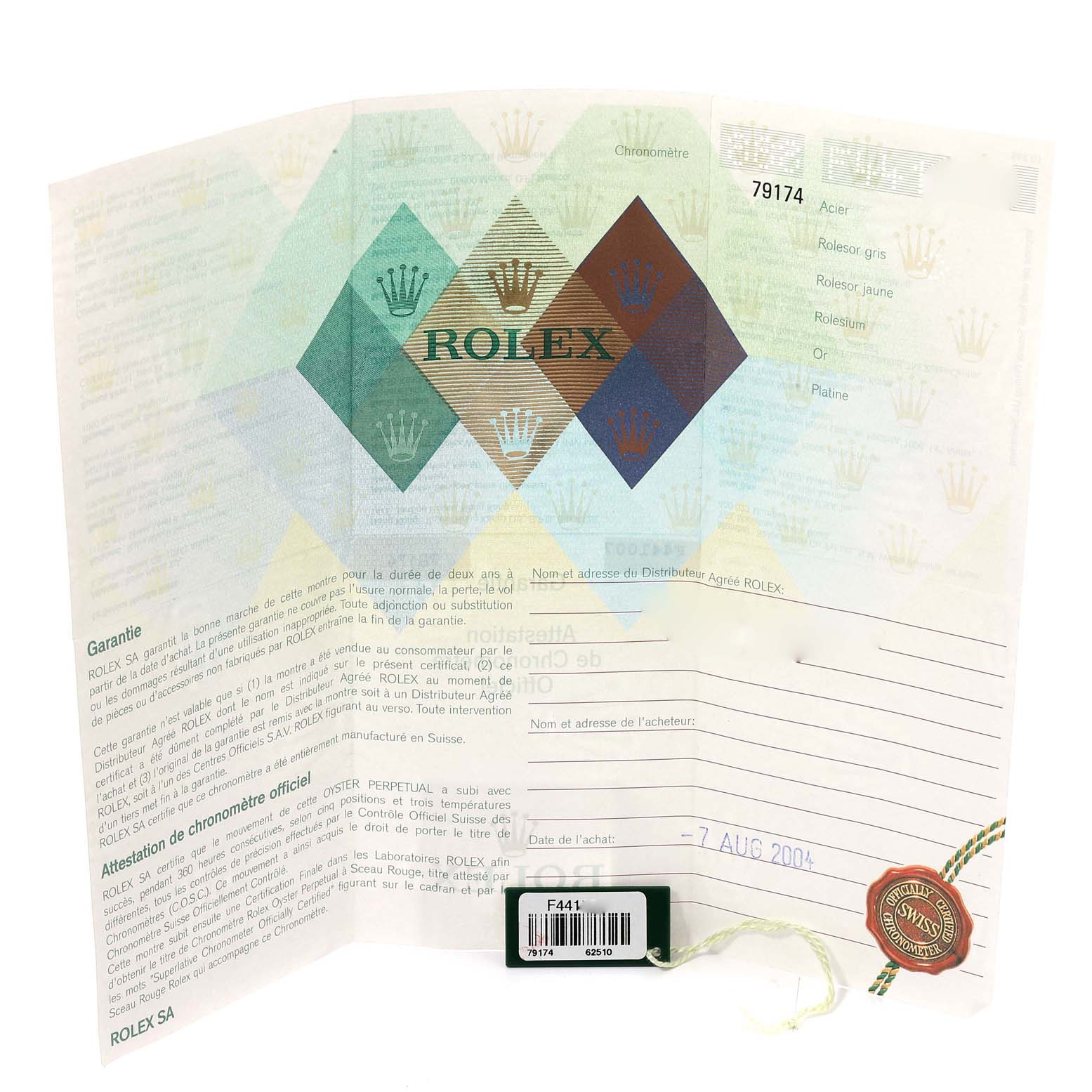 This image shows a warranty and authenticity certificate for a Rolex Datejust 79174 Women's Stainless Steel Black Dial 79174 Women's Stainless Steel Black Dial model, along with its tag and the model number 79174.