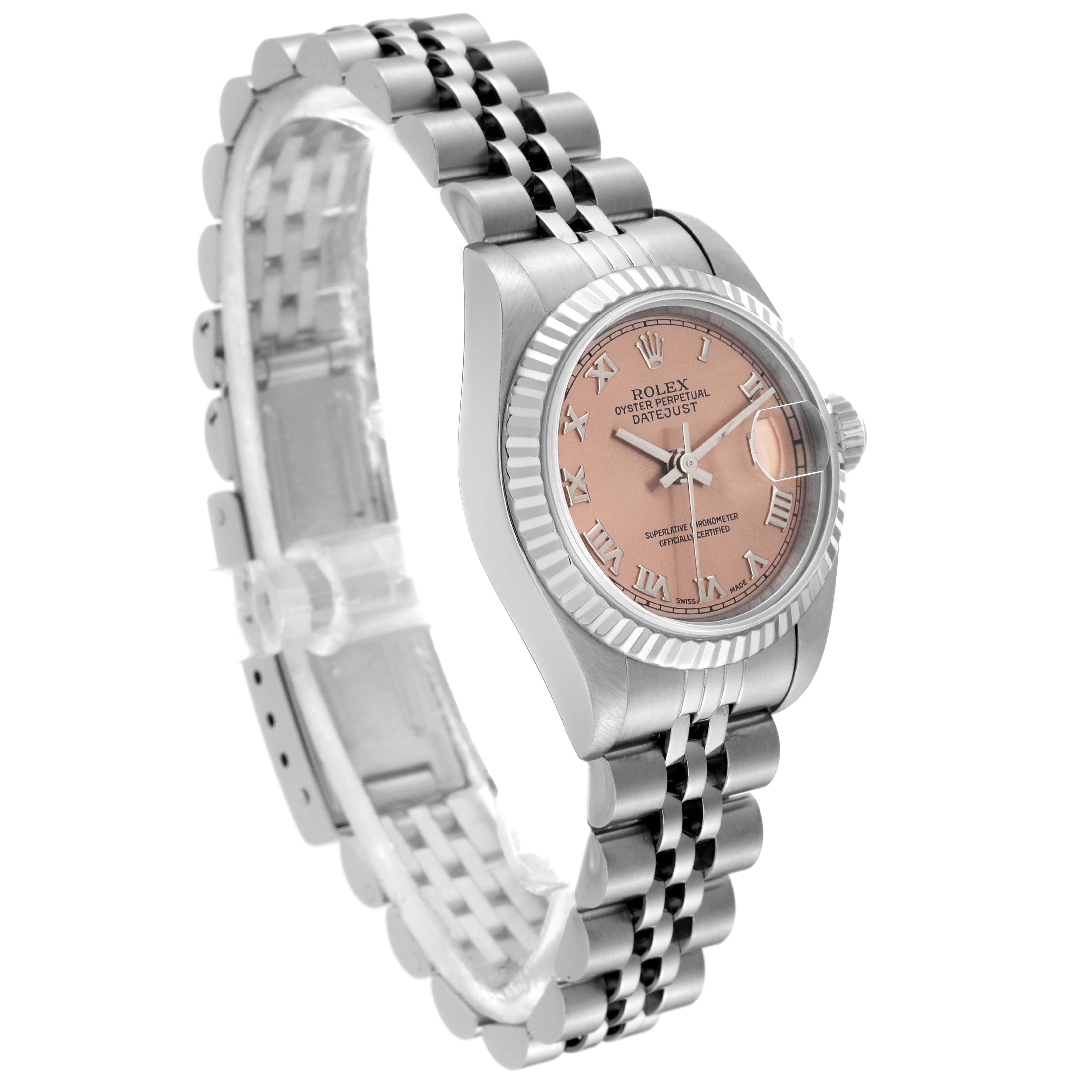 The Rolex Datejust 69174 Women's Stainless Steel Pink Dial 69174 Women's Stainless Steel Pink Dial watch is shown from an oblique angle, displaying its pink dial, fluted bezel, and jubilee bracelet.