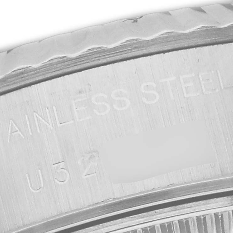 This image shows a close-up of the side engraving on the stainless steel case of a Rolex Datejust 69174 Women's Stainless Steel Pink Dial 69174 Women's Stainless Steel Pink Dial watch.
