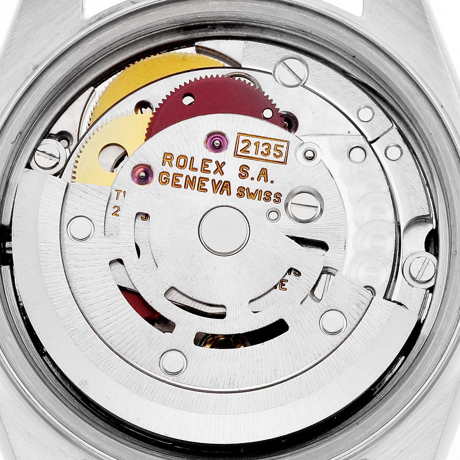 This is a close-up view of the movement mechanism inside a Rolex Datejust 69174 Women's Stainless Steel Pink Dial 69174 Women's Stainless Steel Pink Dial watch, showing gears and engraved details.