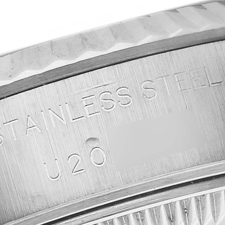 The image shows a close-up of the case's side and part of the bezel of a Rolex Datejust 69174 Women's Stainless Steel Pink Dial 69174 Women's Stainless Steel Pink Dial model, with "STAINLESS STEEL" engraving visible.