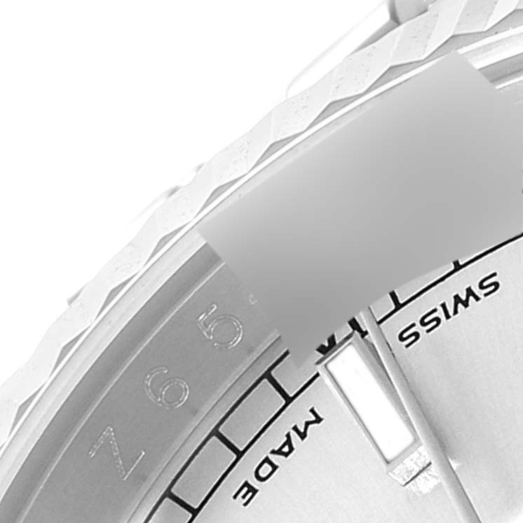 This close-up angle shows the bezel, part of the dial, and "SWISS MADE" marking of the Rolex Datejust 116234 Men's Stainless Steel Silver Dial 116234 Men's Stainless Steel Silver Dial watch.
