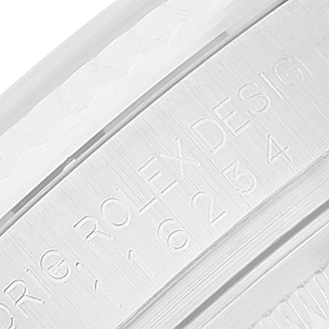 This is a close-up image of the engraved side of the casing for a Rolex Datejust 116234 Men's Stainless Steel Silver Dial 116234 Men's Stainless Steel Silver Dial watch.
